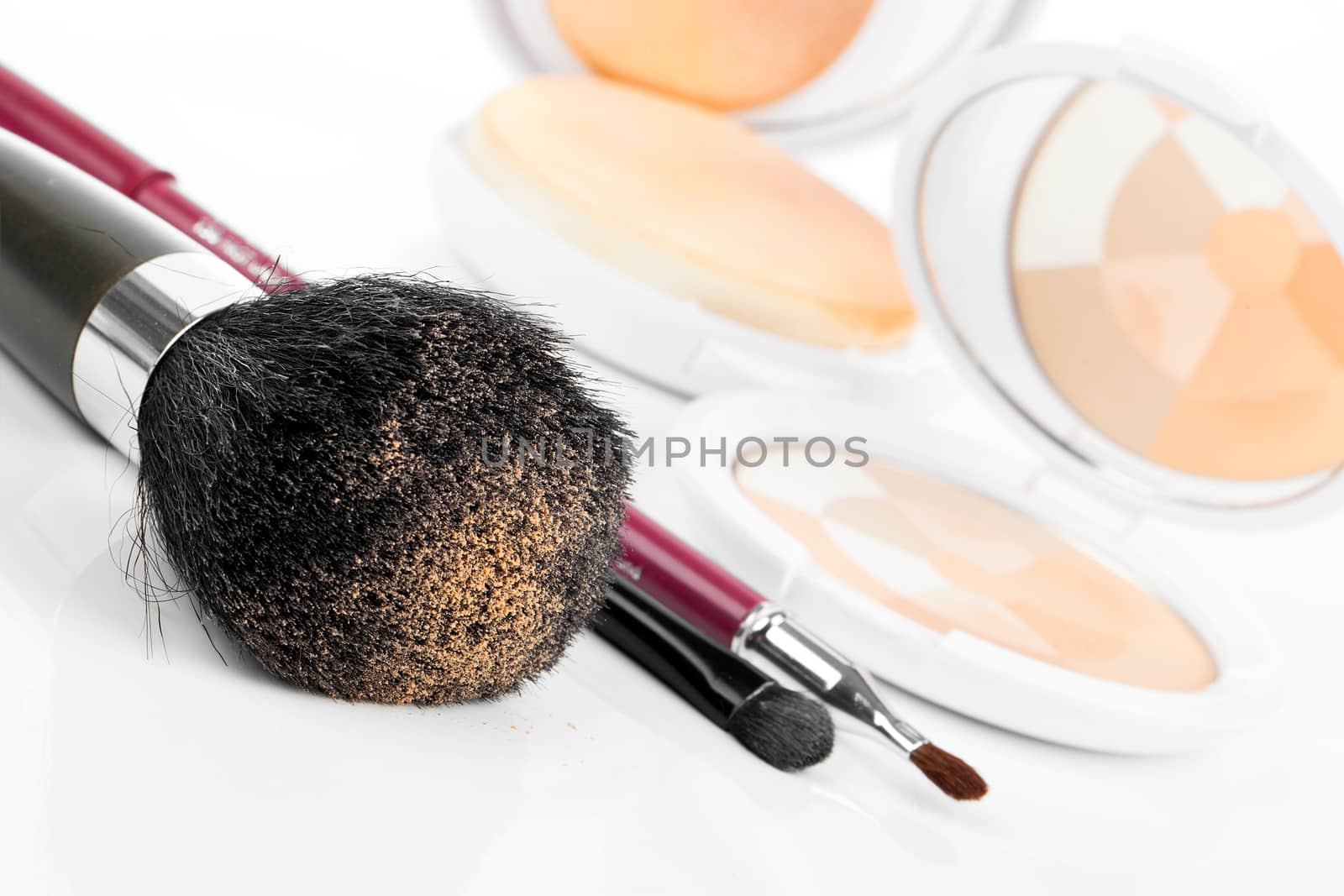 compact powder and black brush isolated