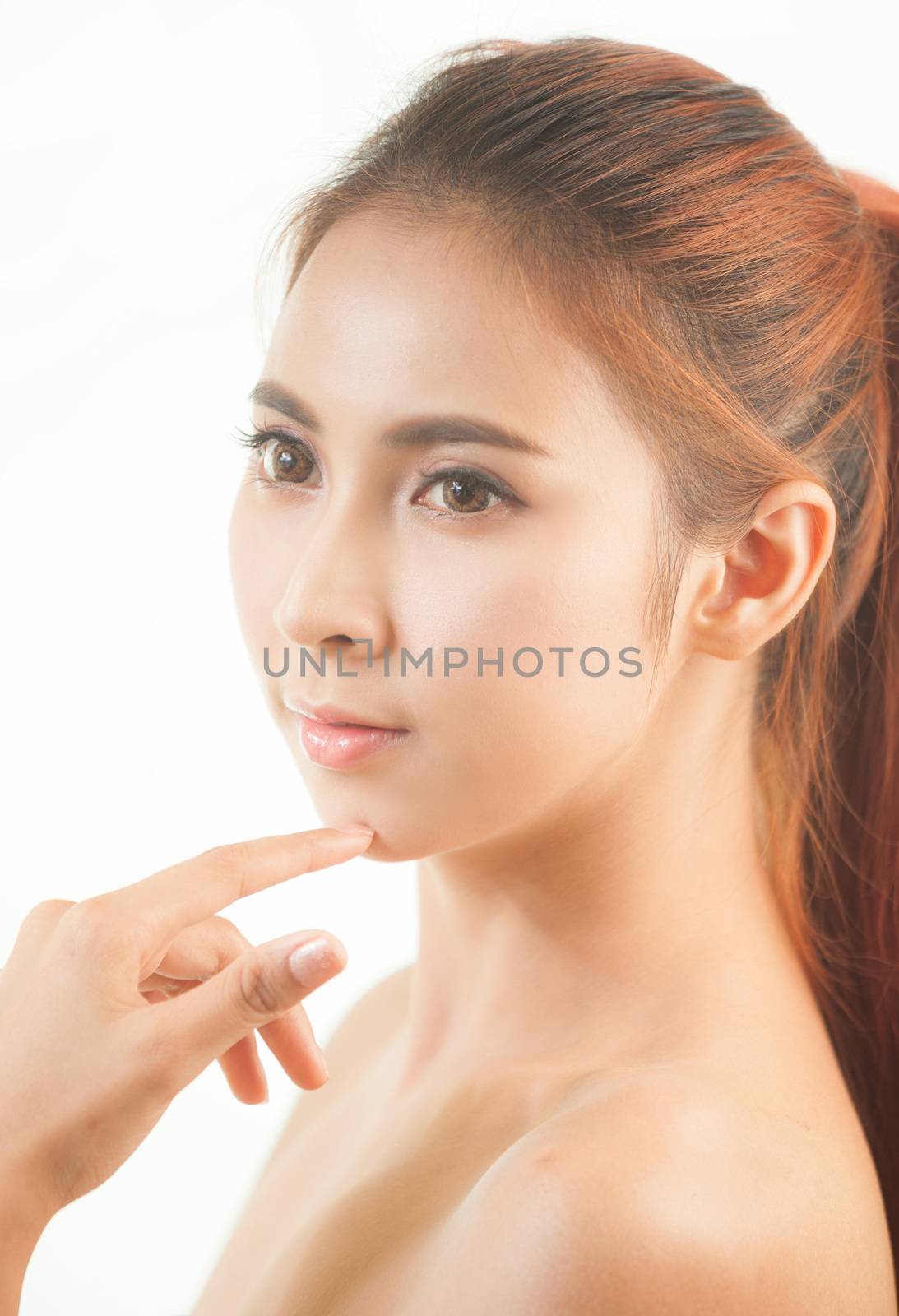 Portrait of beautiful young asian woman with clean face isolated on white background