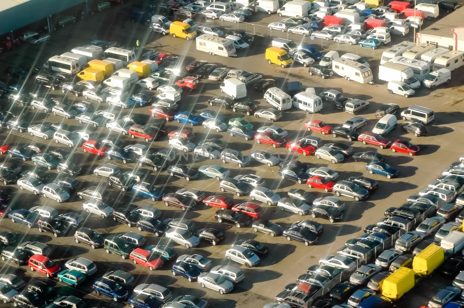 aerial view of vehicles in a parking lot - no visible trademarks