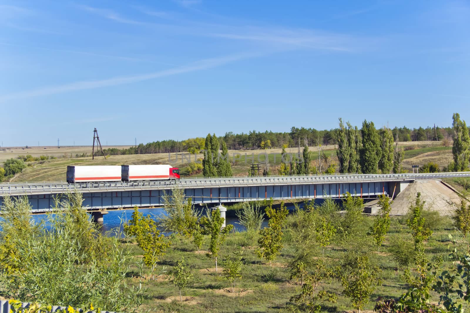 Photo of landscape with bridge and lorry