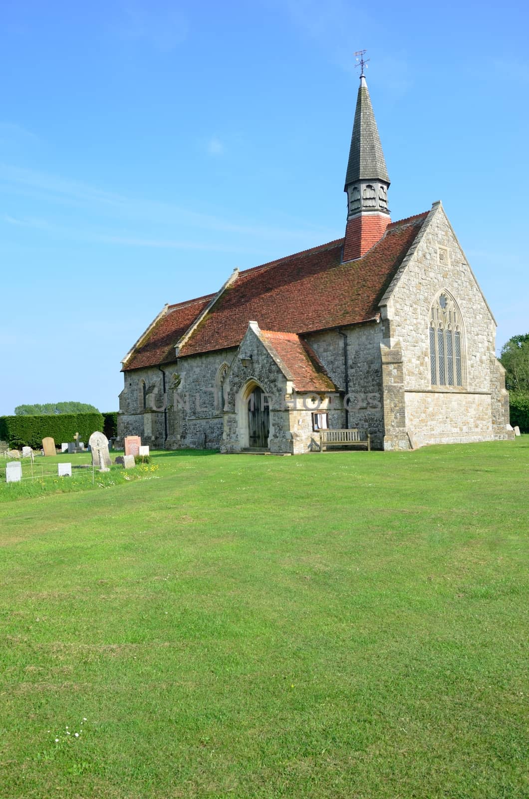 English church on green lawn