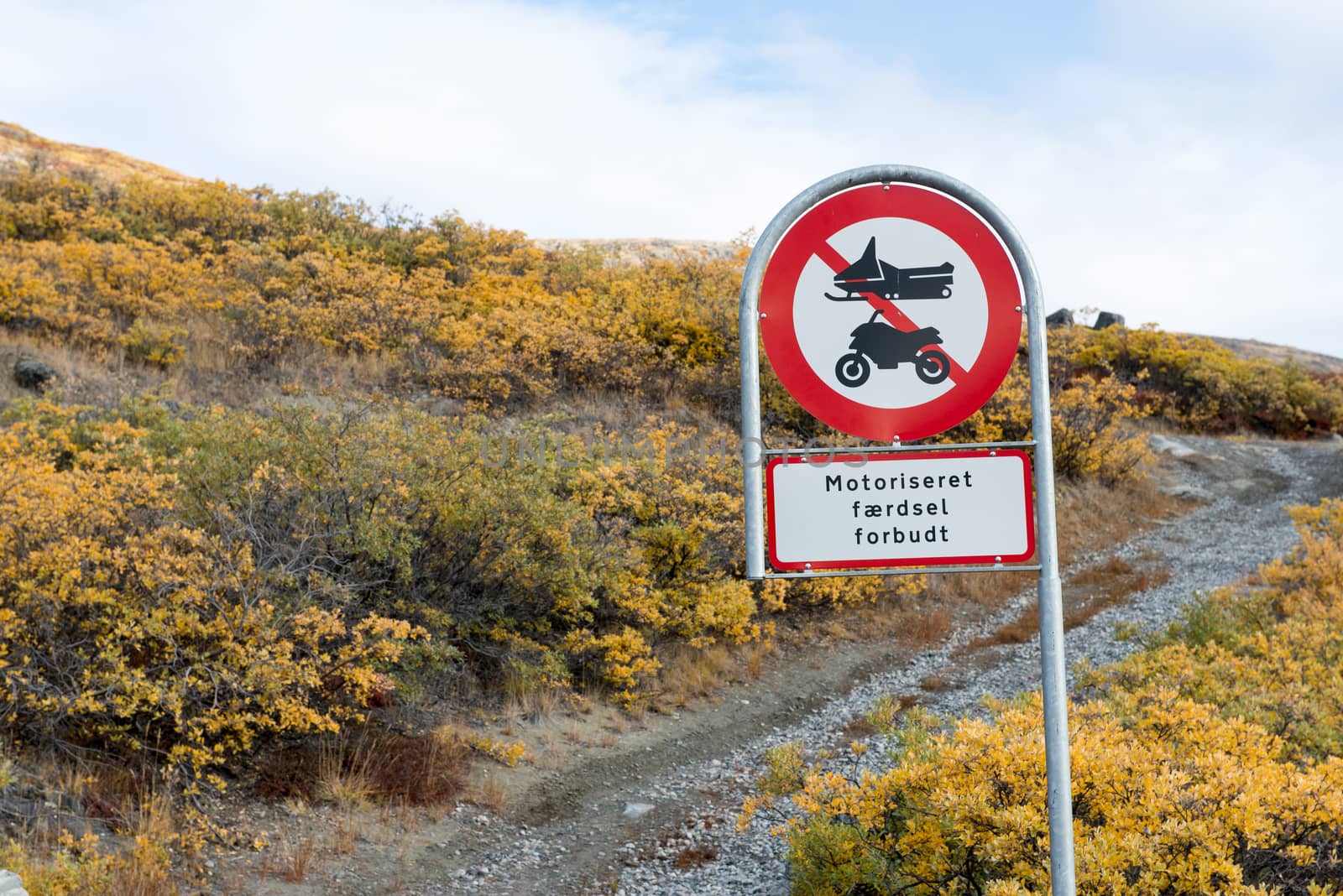 Greenlandic street sign with snow scooter and motor cycle