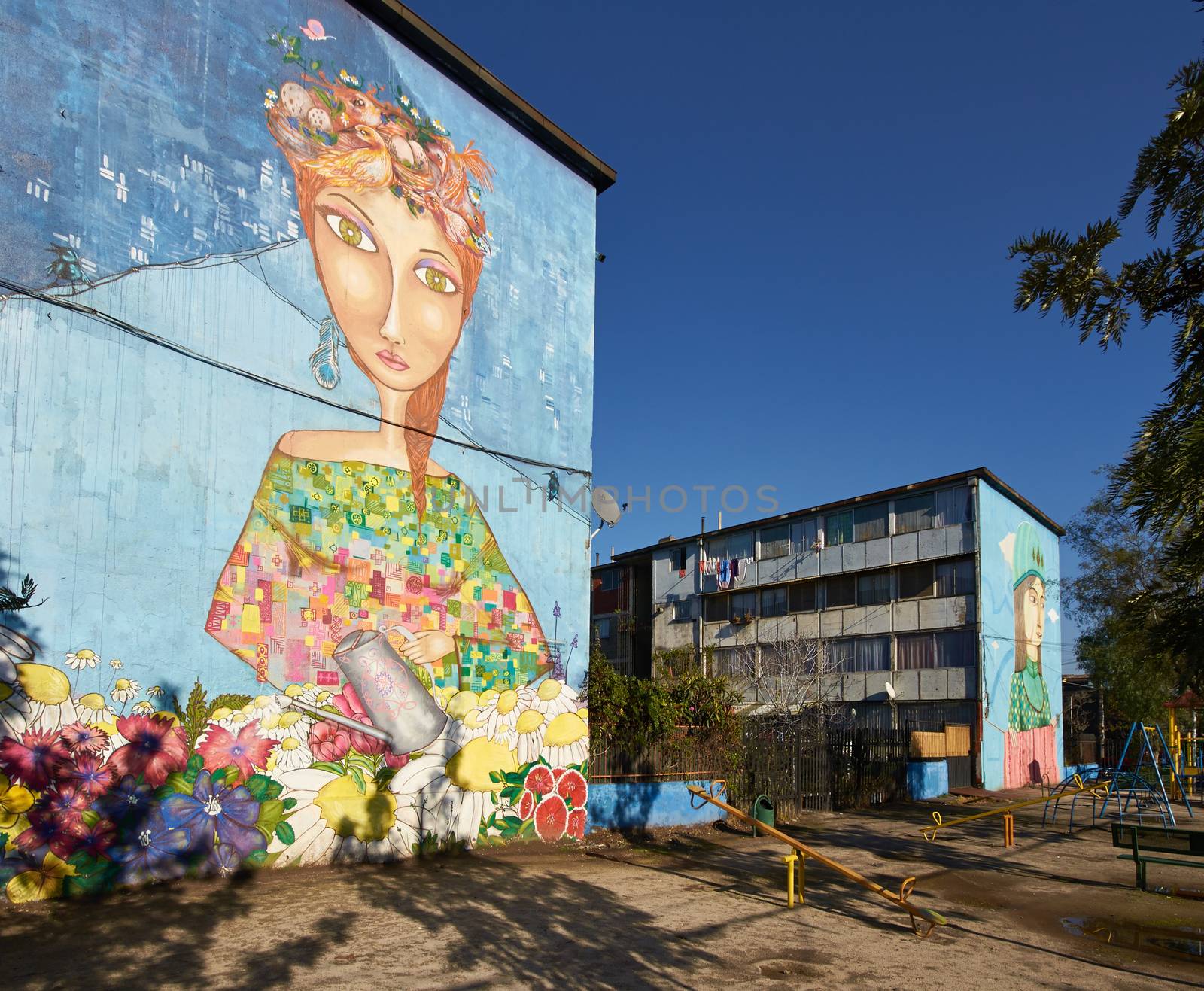 Colourful murals adorning the walls of tenement blocks in the San Miguel area of Santiago, capital of Chile. The area was created as an open air museum in what was a run down area of the city.