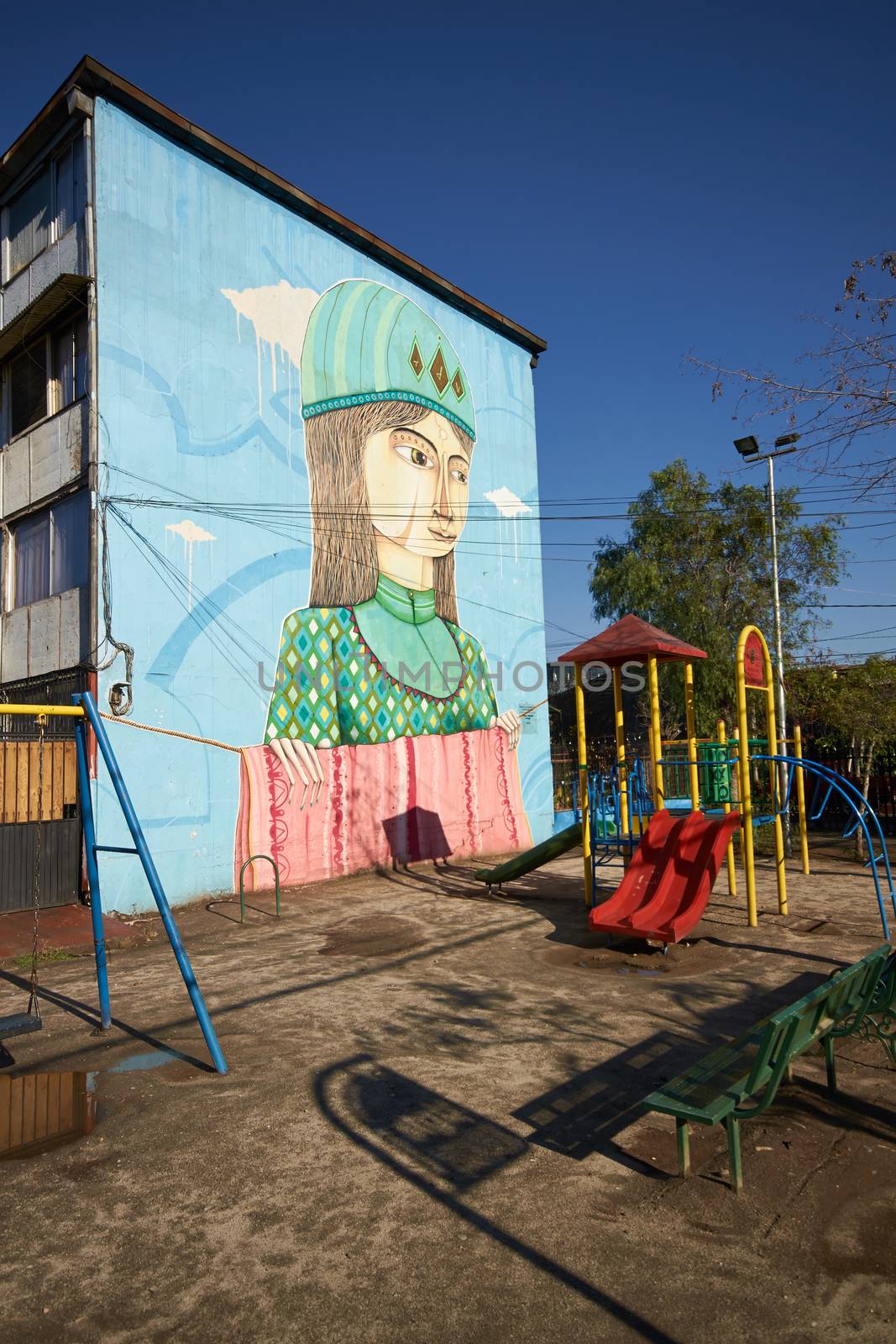 Colourful murals adorning the walls of tenement blocks in the San Miguel area of Santiago, capital of Chile. The area was created as an open air museum in what was a run down area of the city.