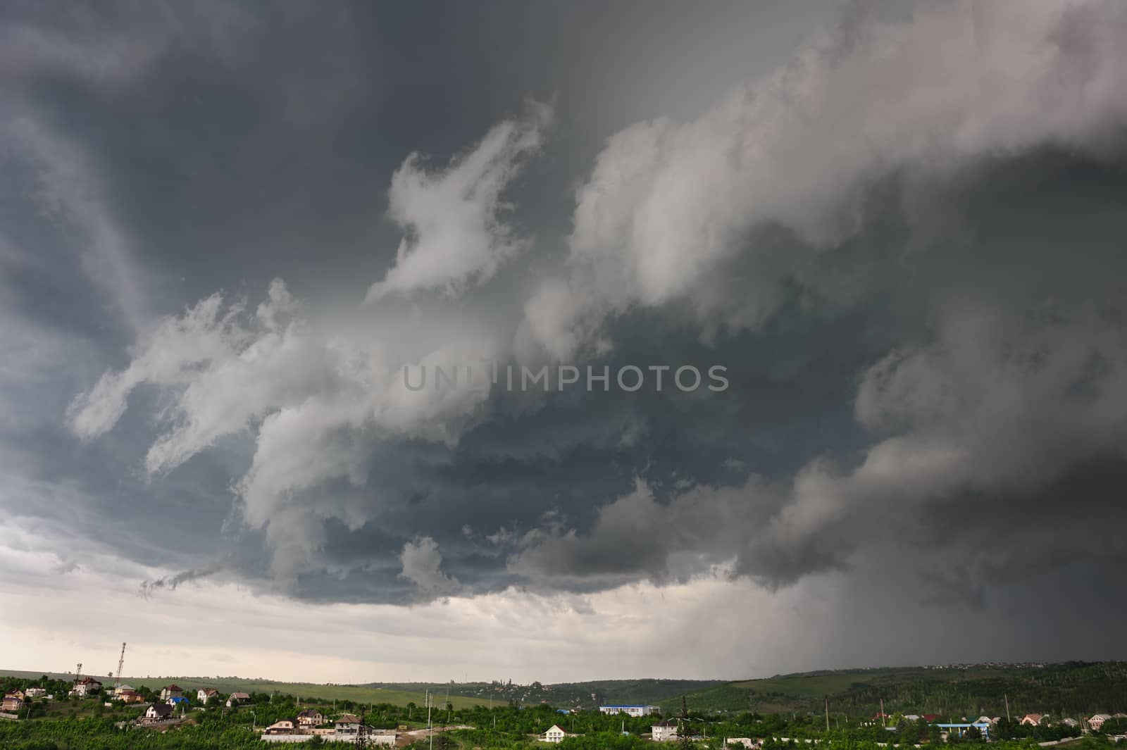 Beginning of the storm, cold weather front covers the village. Panorama stitched from 4 mages.