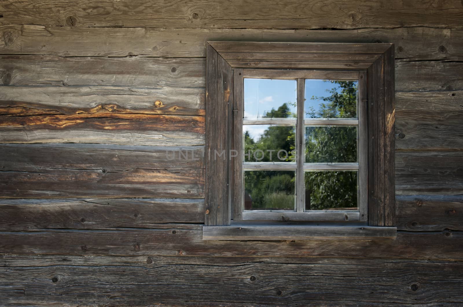 Window of old wooden house by sibrikov