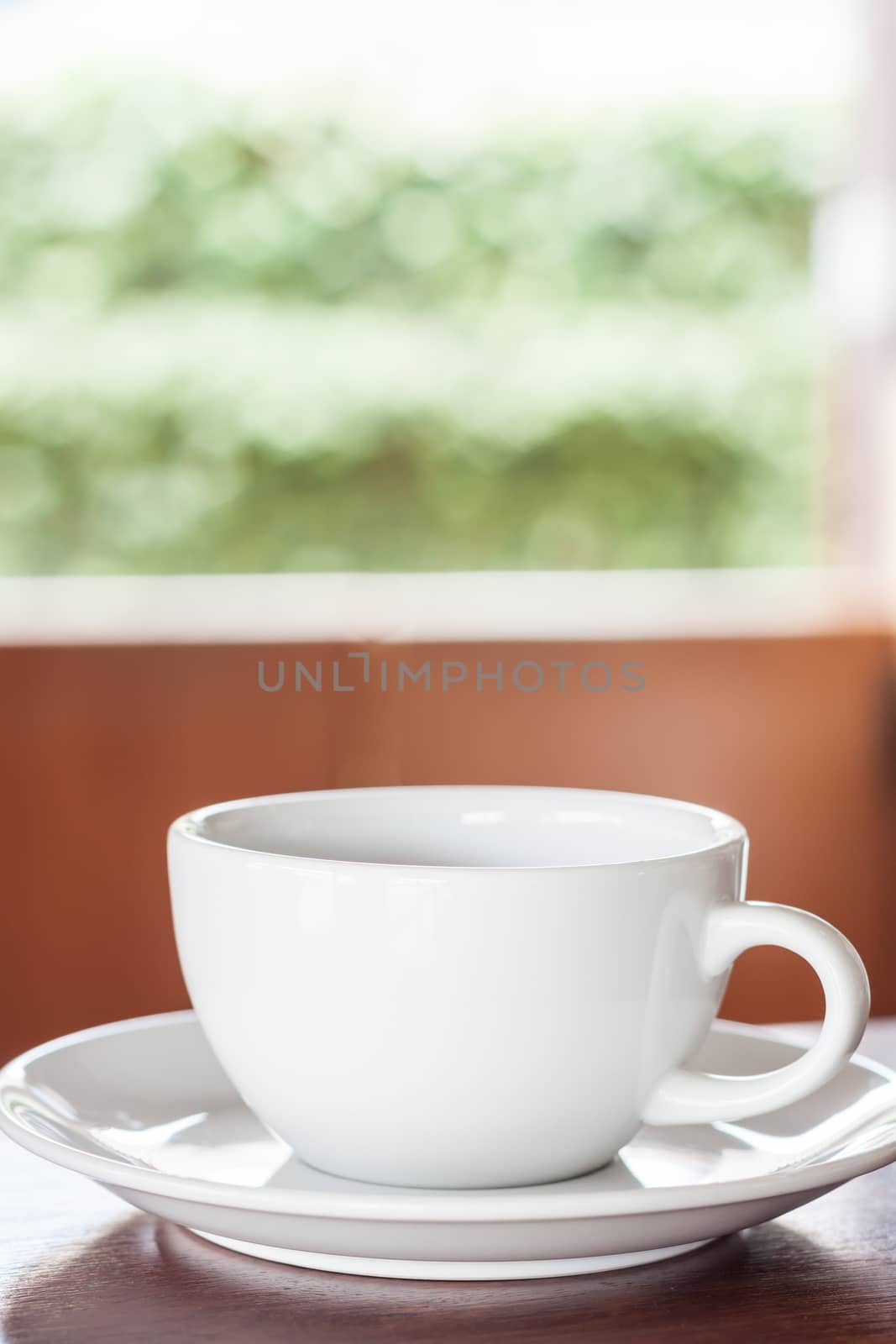 Closeup of a cup of coffee at coffee shop, stock photo