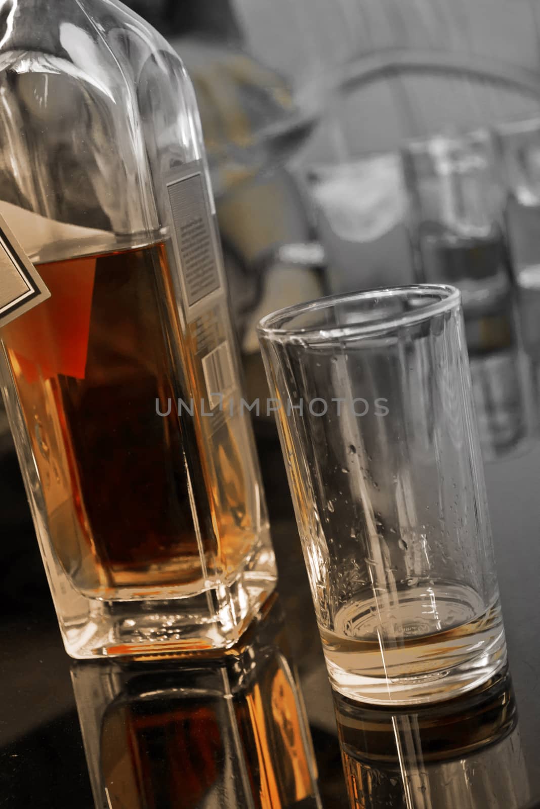 Whiskey drinks on table by Thanamat