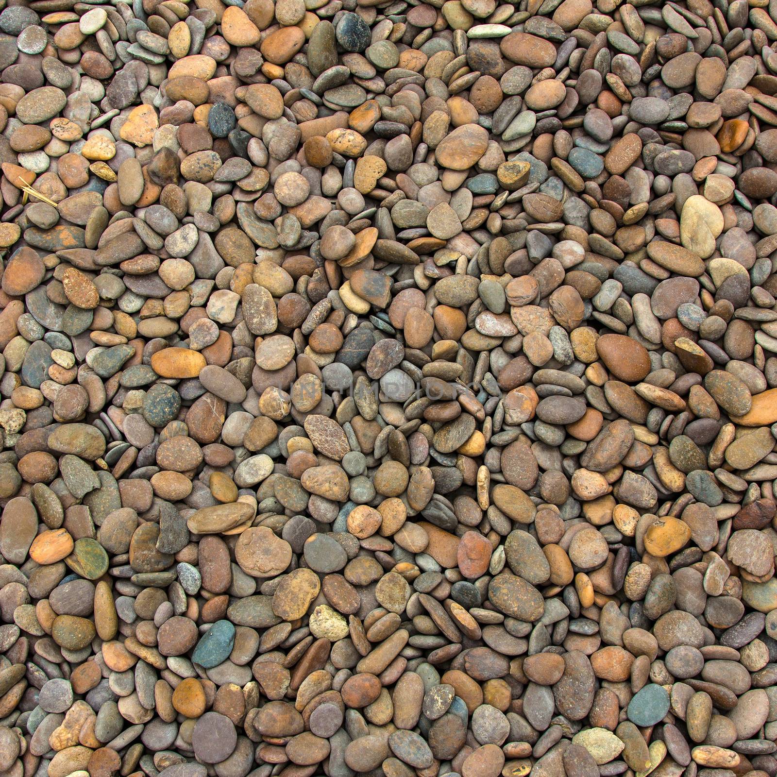 Pile of round peeble stones for background