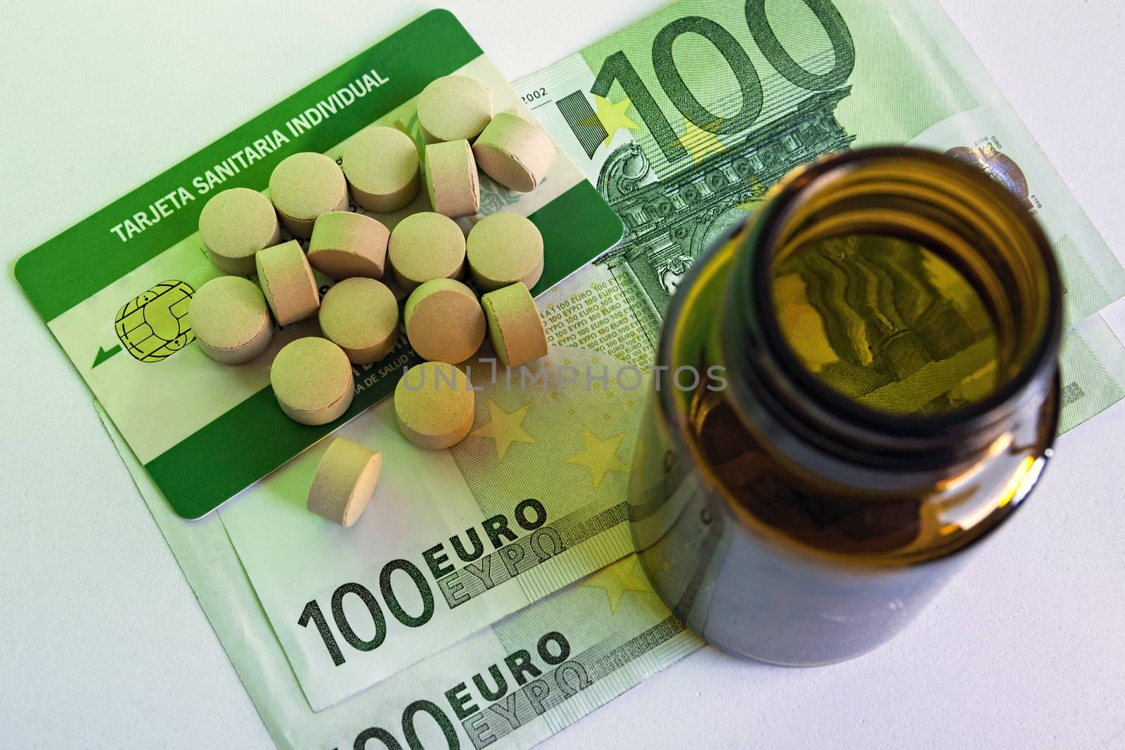 tablets and pill bottle, concept of pharmaceutical copayment