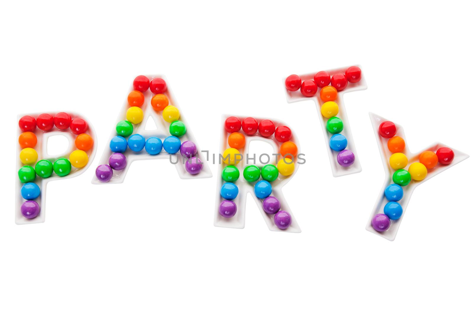 Party letter trays filled with a rainbow of colorful bubble gum.  Shot on white background.