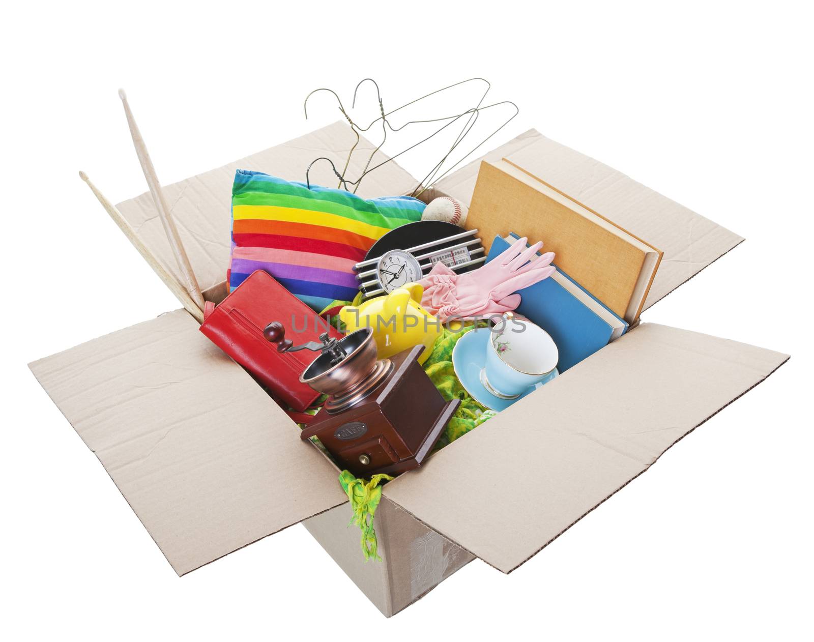 Box of used items ready for a garage sale, auction, or donation to a charitable organization.  Shot on white Background.