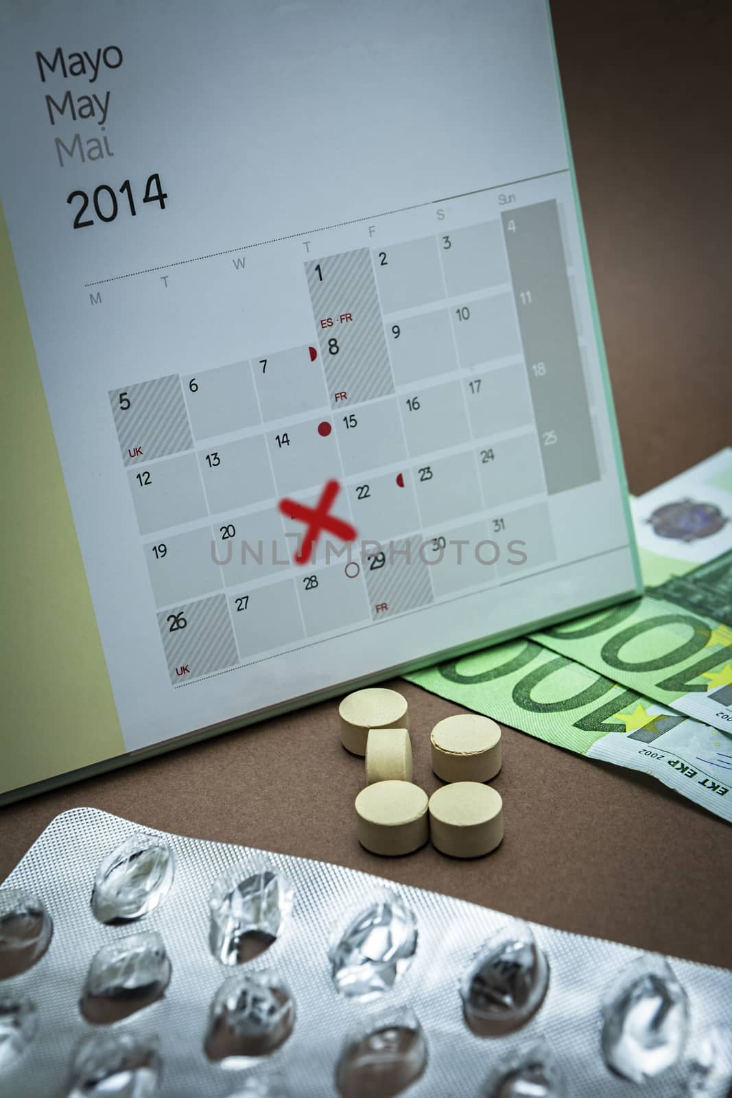 control pills on a calendar, reminder to pay for medicines in the Pharmacy