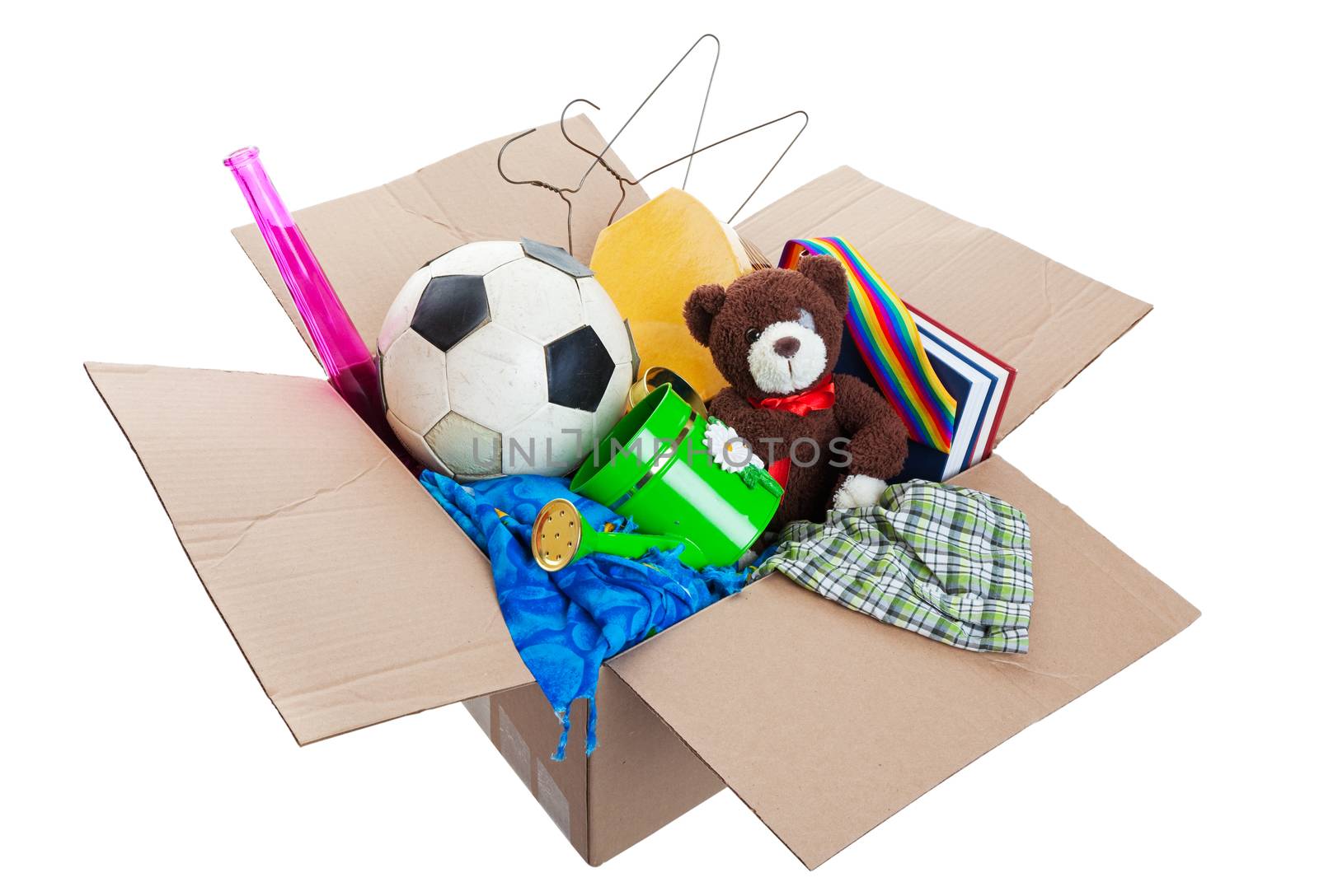 A box of unwanted stuff ready for a garage sale or to donate to a charitable organization.  Shot on white background.