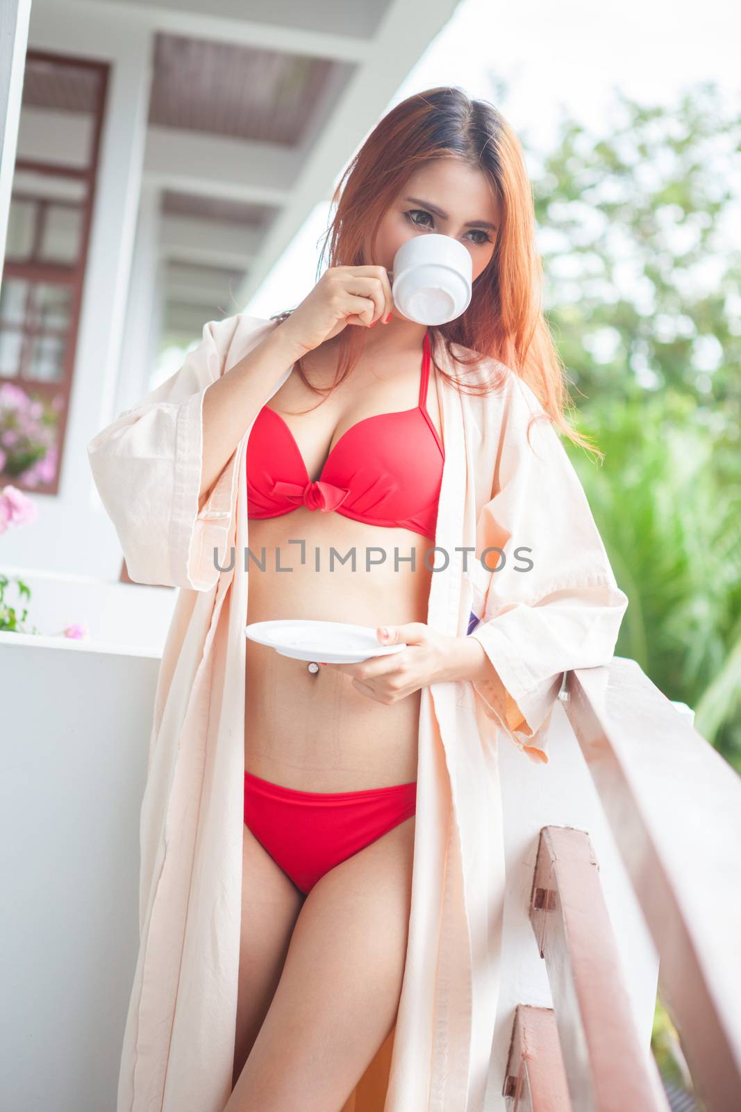 Portrait of Beautiful sexy asian woman holding cup