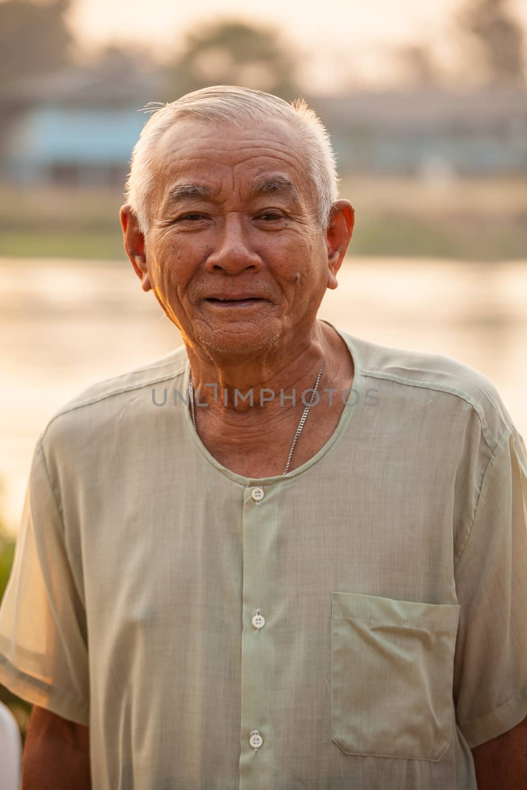 Portrait Of Happy Senior Asian Man At Outdoor