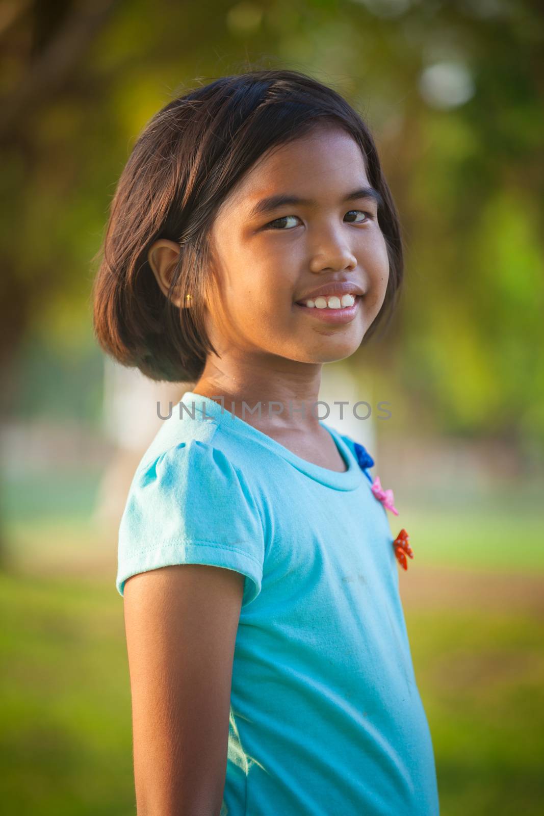 Portrait asian girl in the park on sunset
