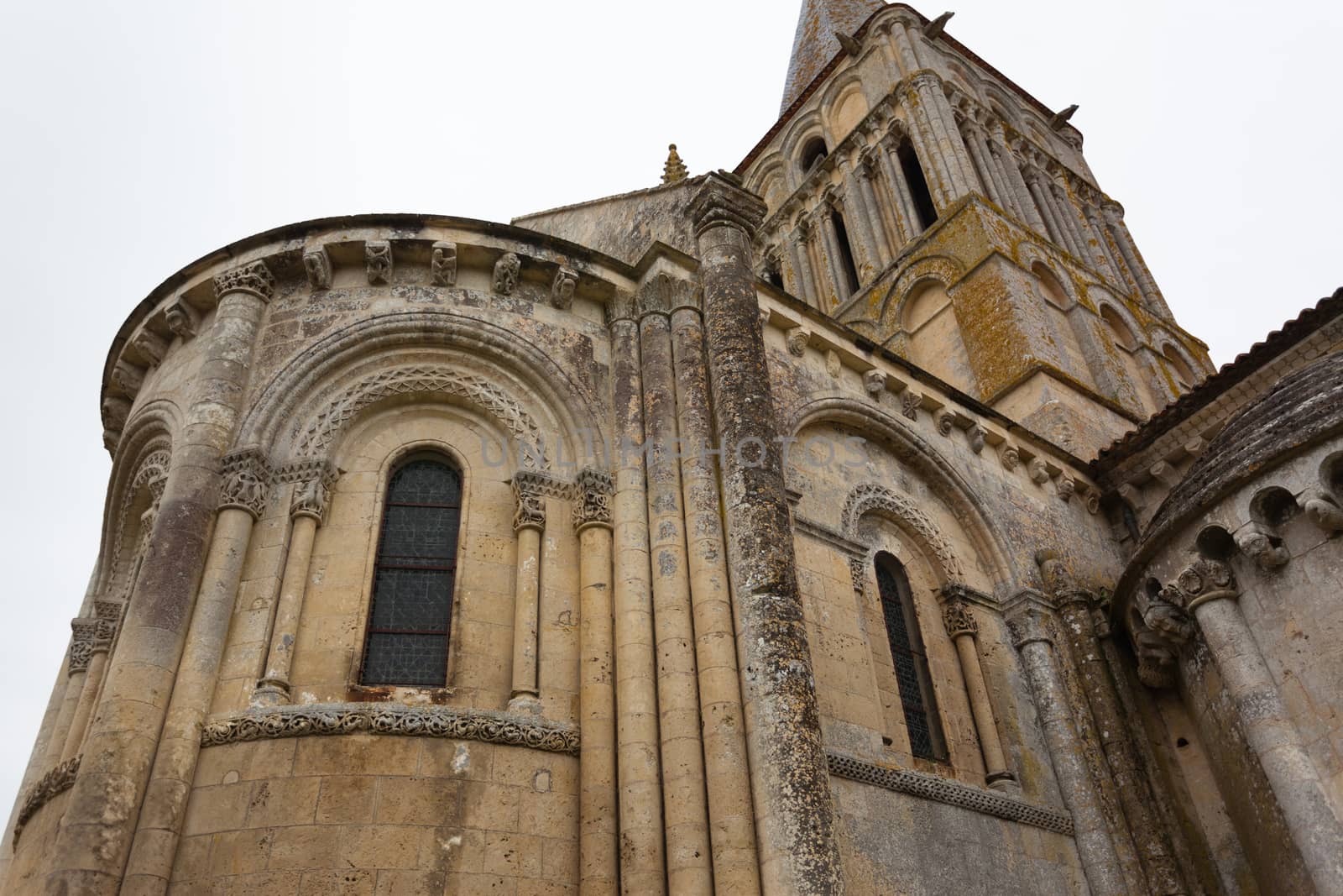 Close-up abse and tower view of Aulnay de Saintonge church in Charente Maritime region of France