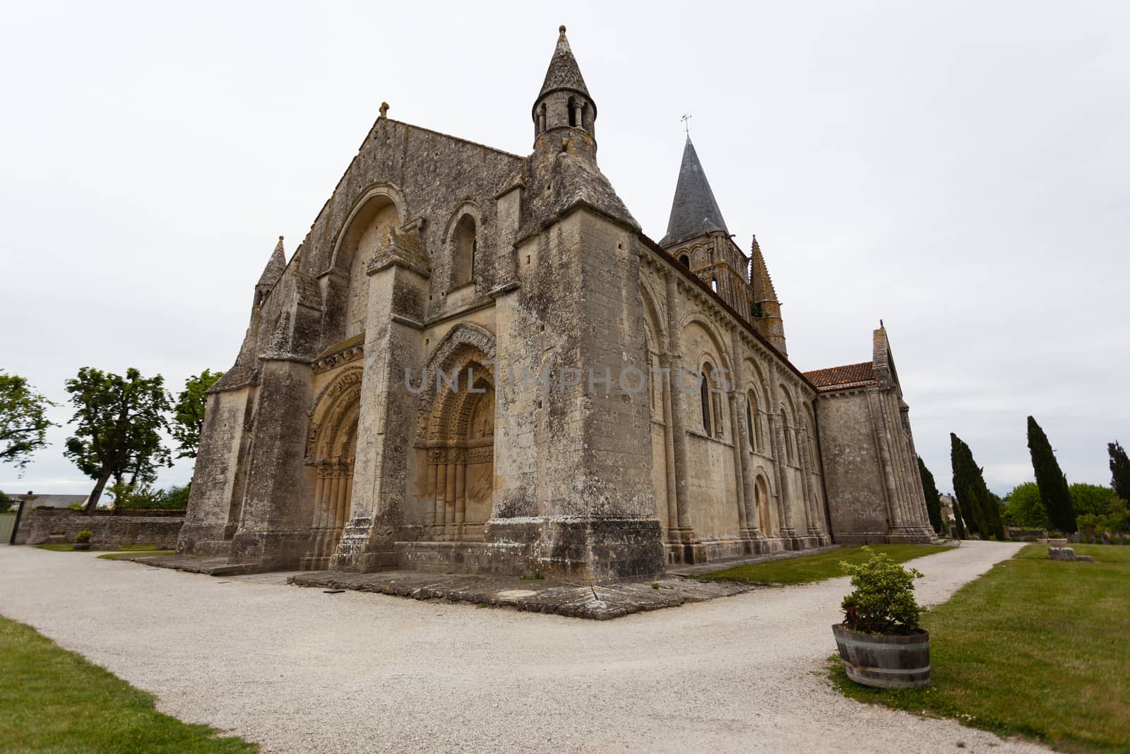 Full side  view of Aulnay de Saintonge church in Charente Maritime region of France
