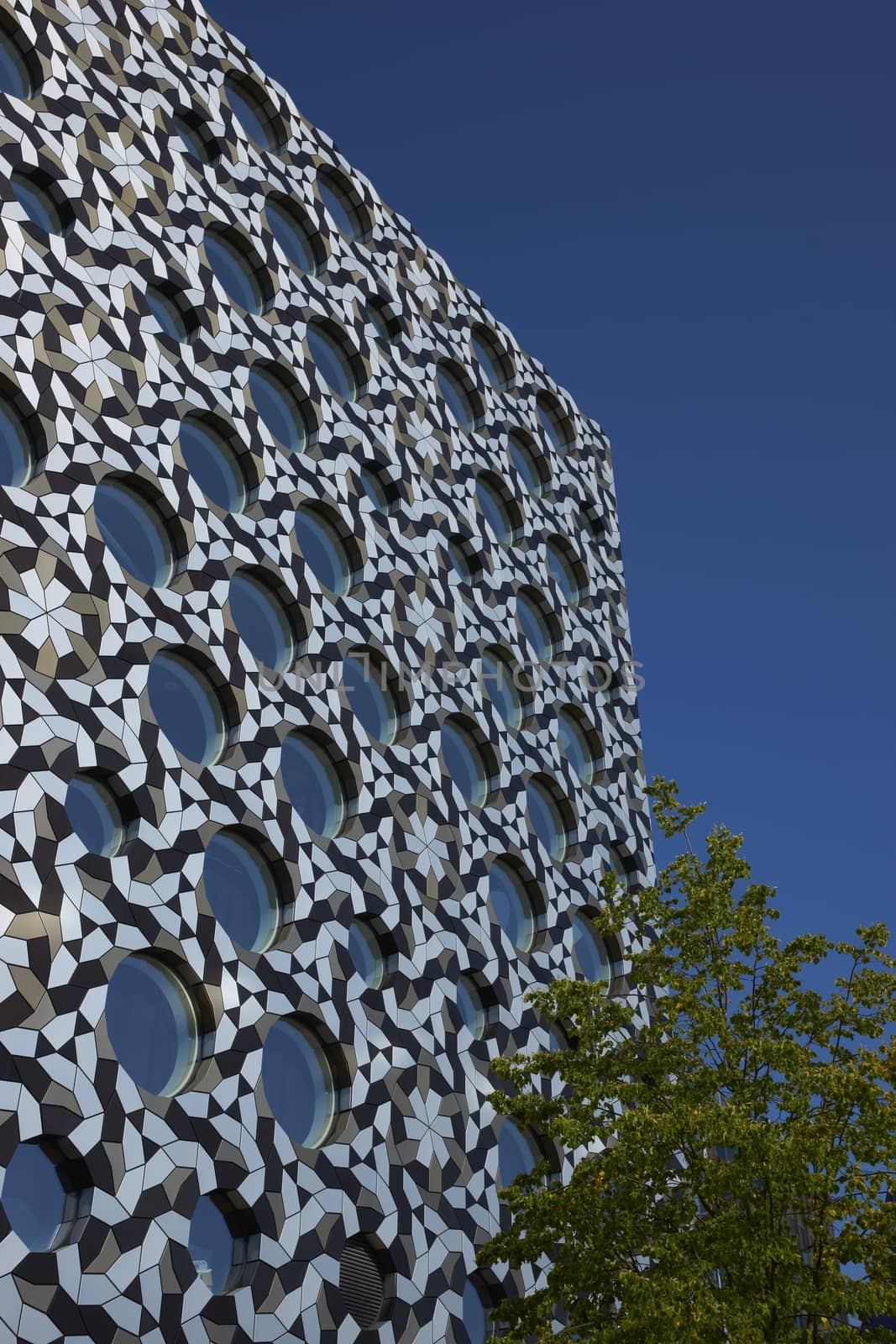 Circular windows in a steel clad modern building in London, United Kingdom
