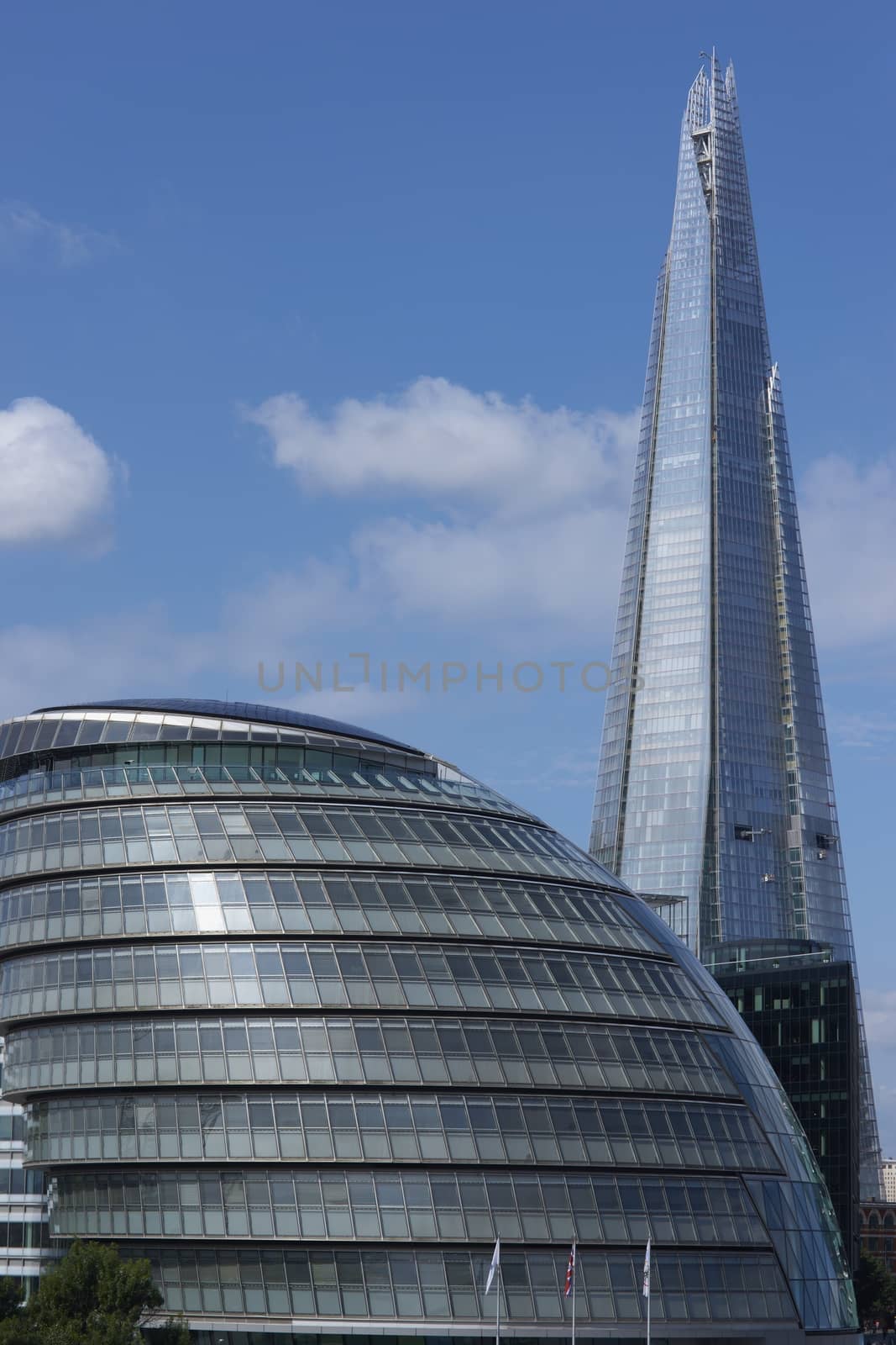Iconic modern buildings on the south bank of the River Thames in London, United Kingdom. The shard tower over the offices of the Mayor of London.