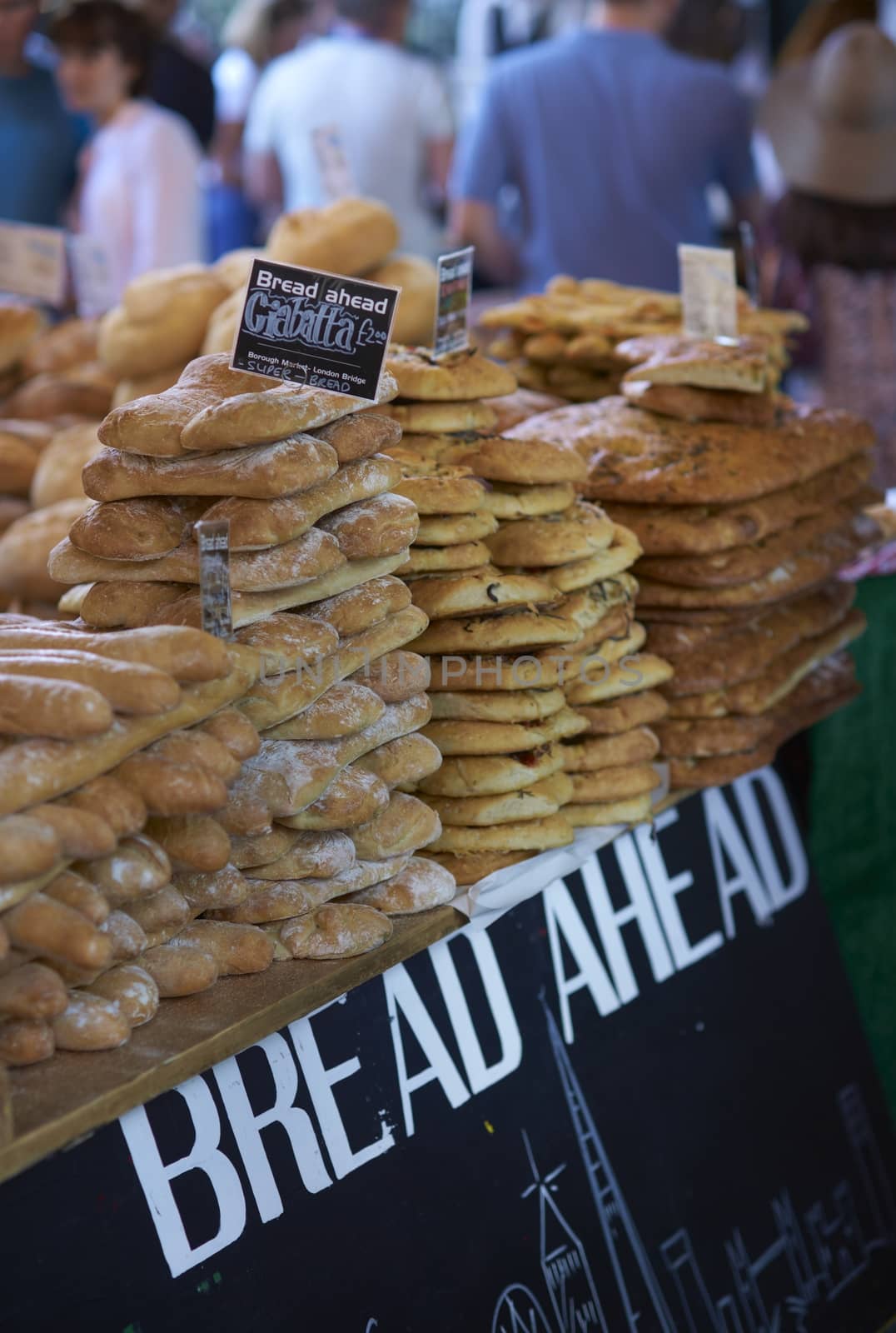 Bread for sale on a market stall in Borough Market, London, England