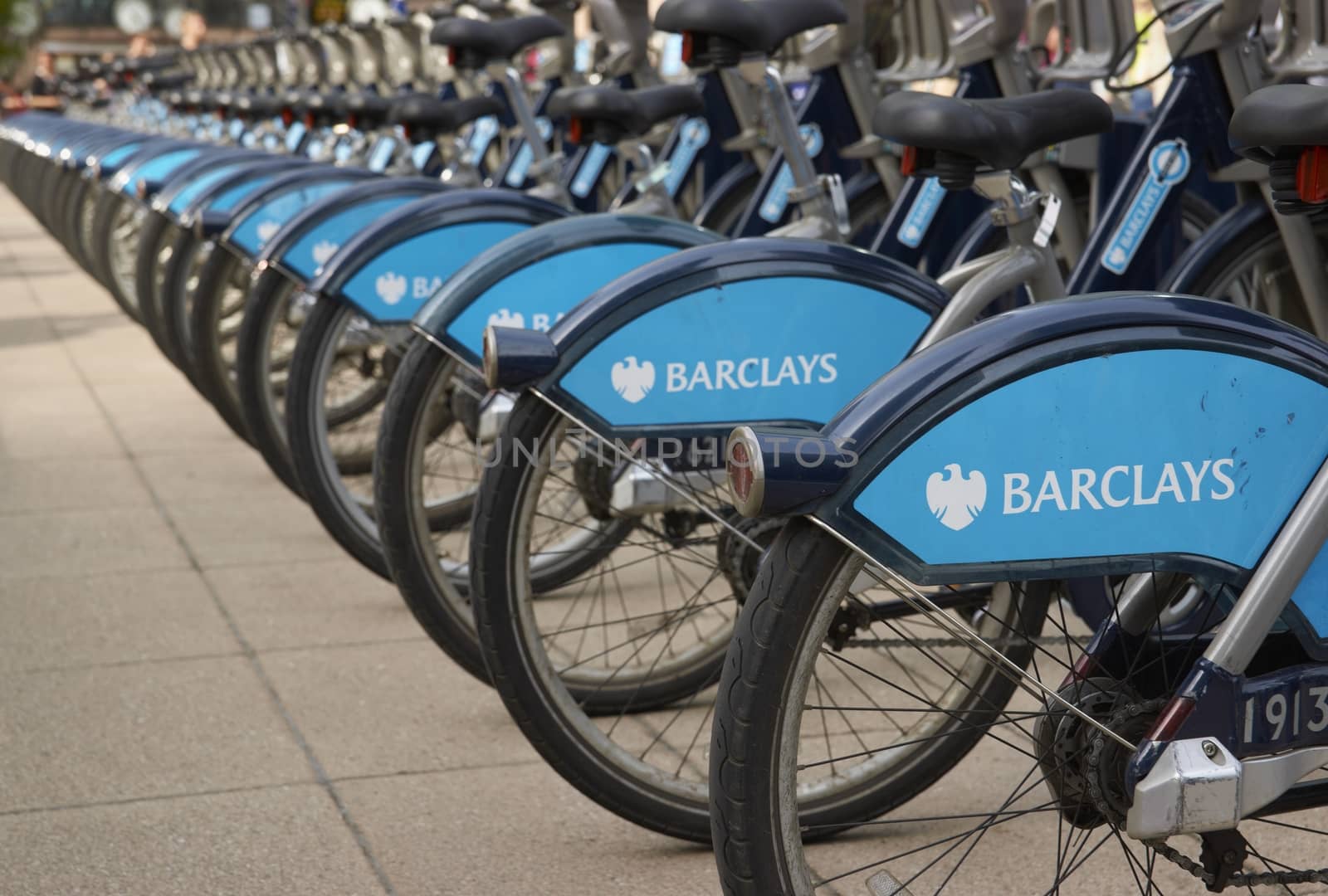Row of identical bicycles available for use by the public in London, Great Britain.