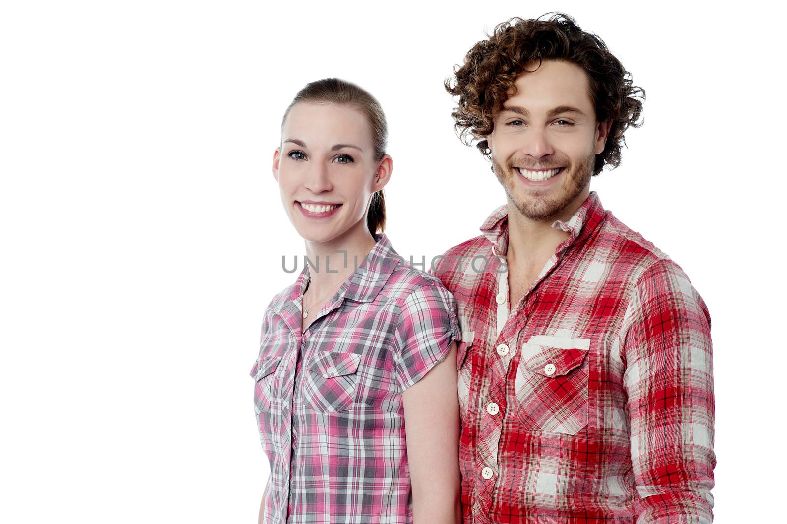Smiling young couple wearing stylish shirts