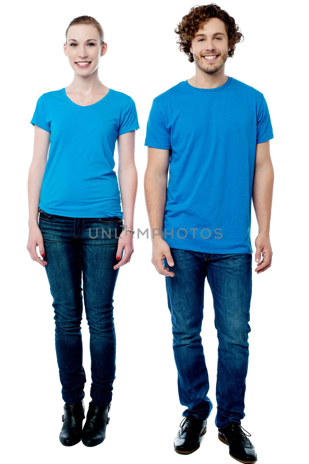 Young woman and man posing together by stockyimages