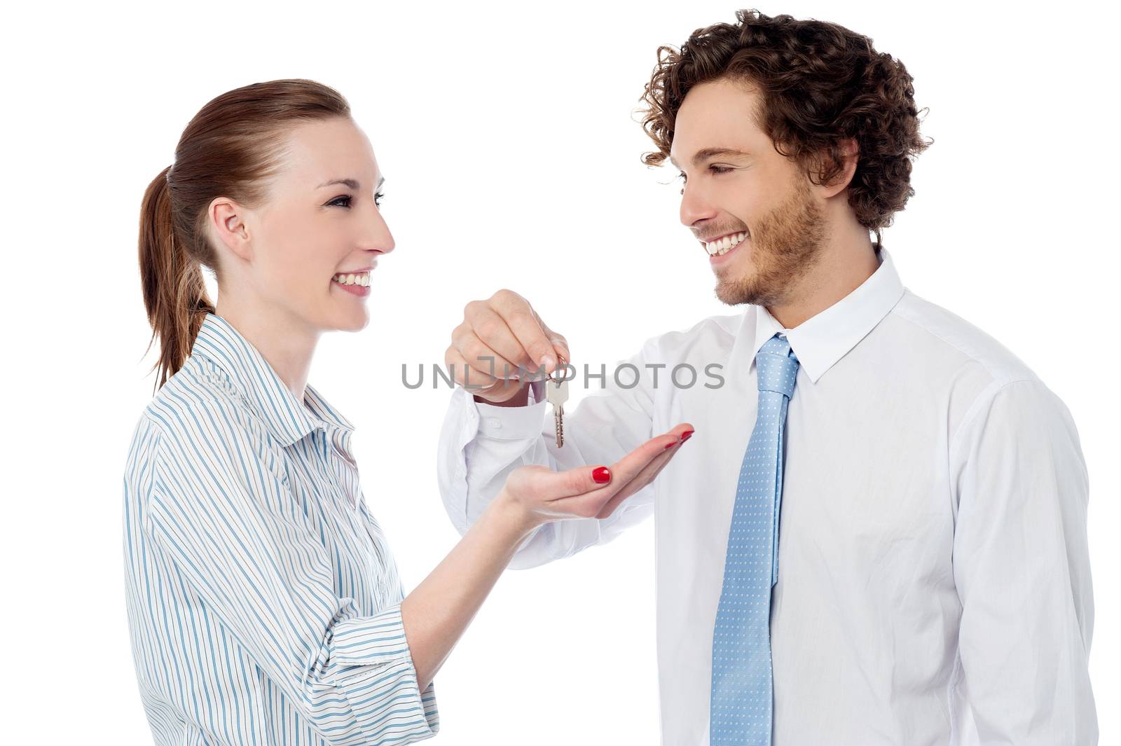 Corporate guy handing over the key to owner