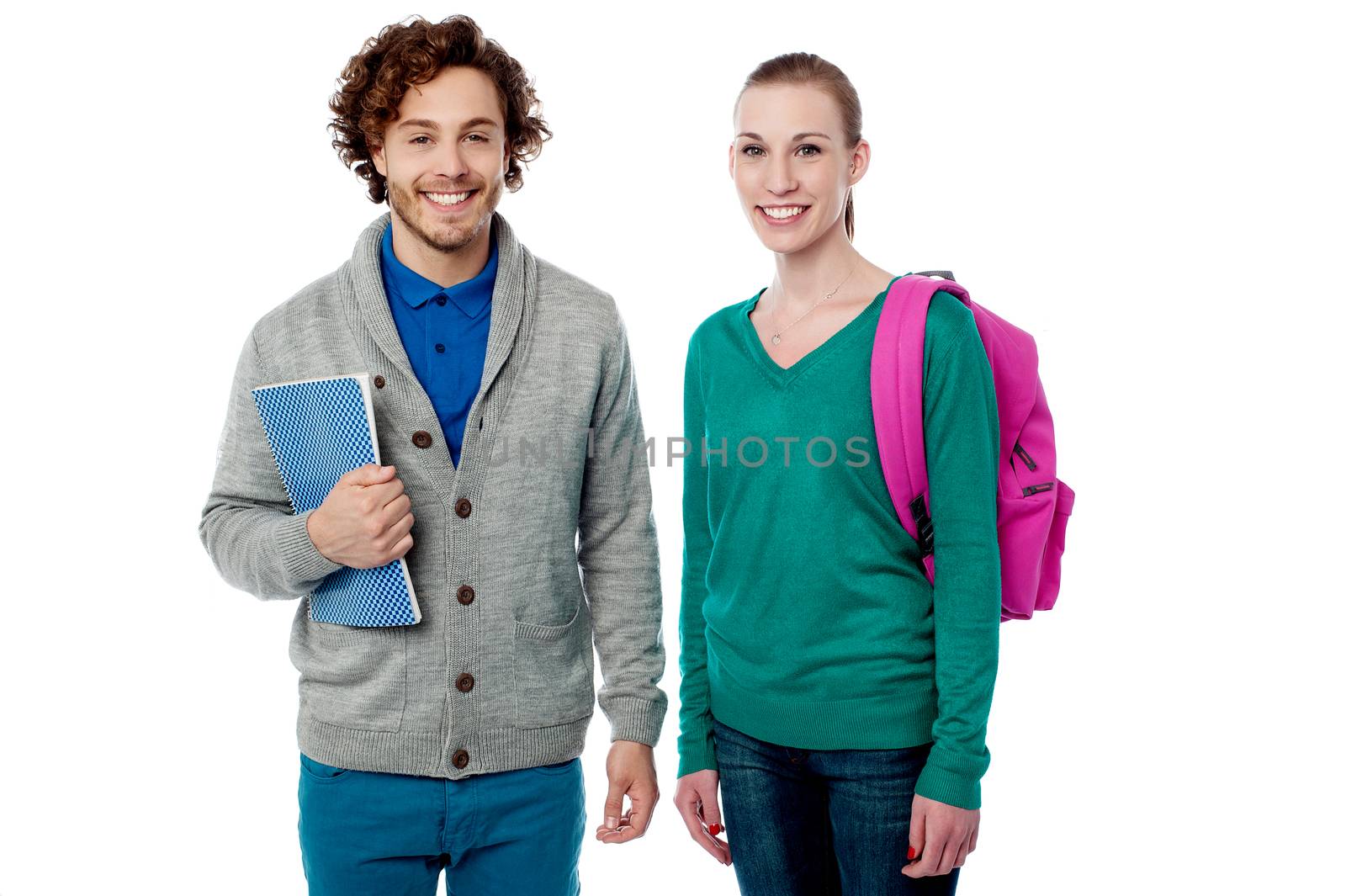 Smiling young students with bag and note book