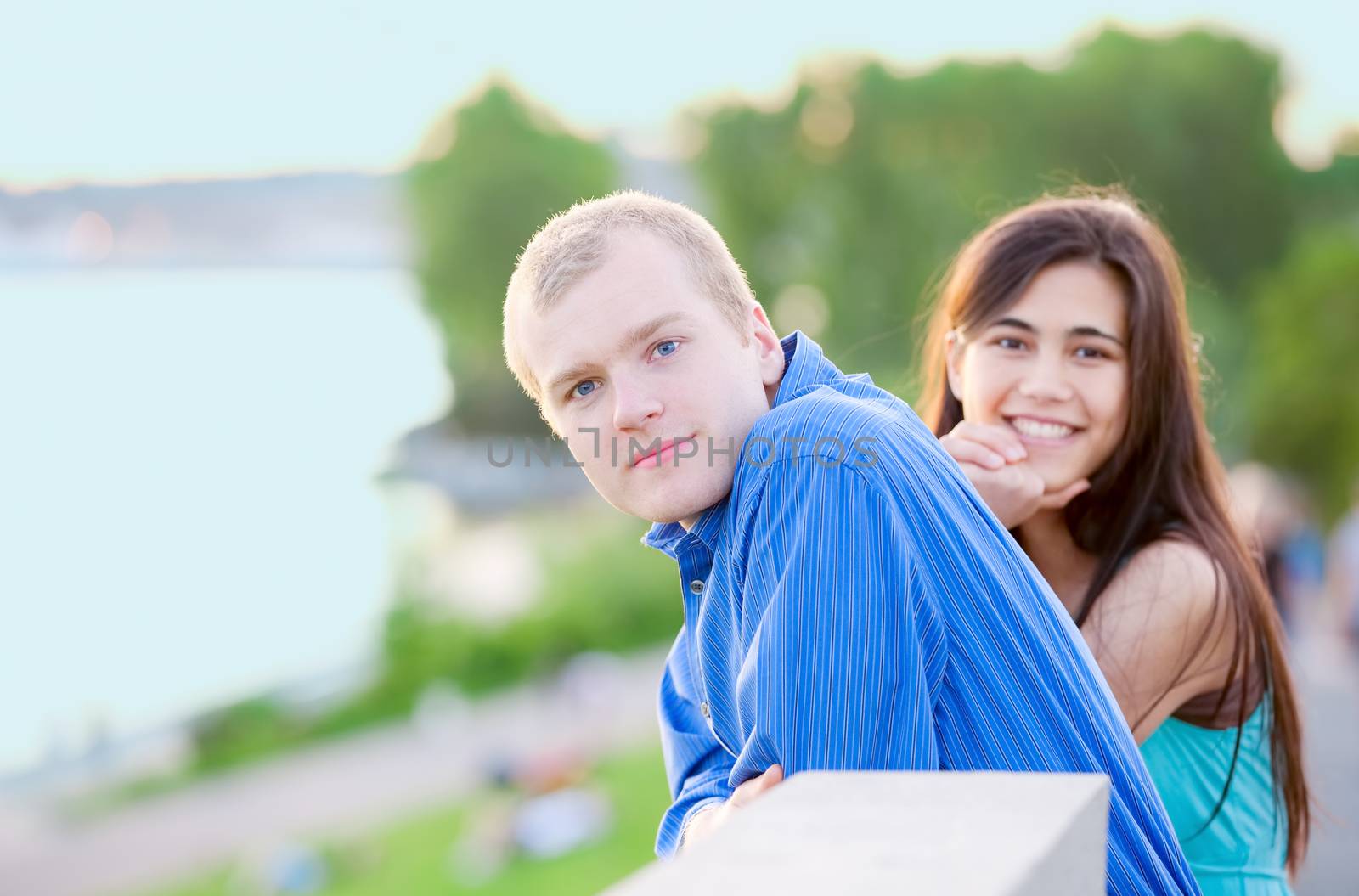 Happy interracial couple standing together outdoors by jarenwicklund