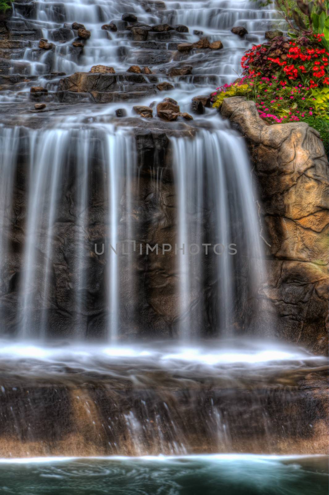 Steams of misty water fall down the hill in High Dynamic Range