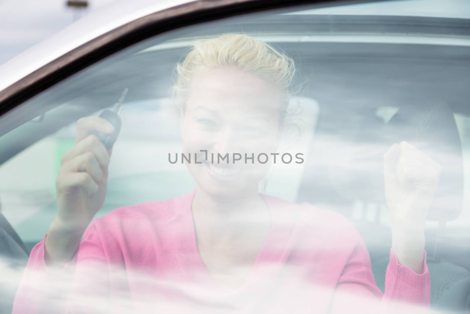 Woman driver showing car keys. by kasto