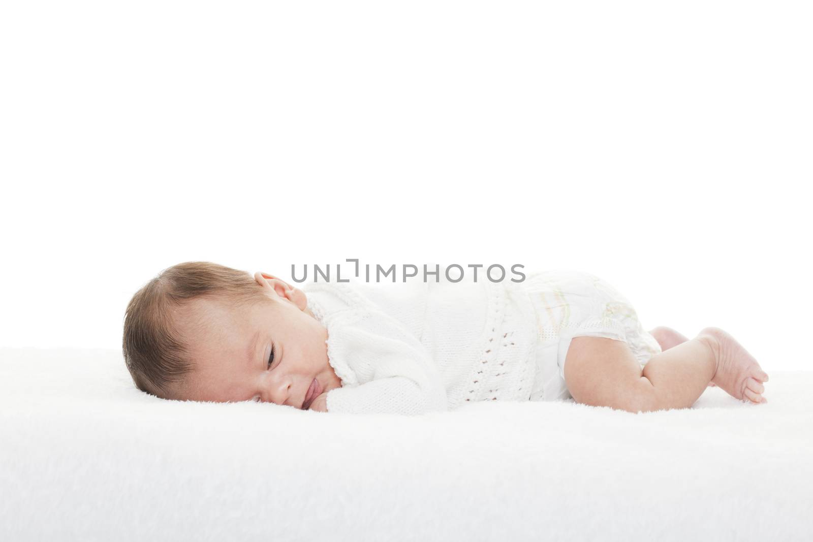 A newborn infant about to take a nap.  Mixed race baby shot on white background.