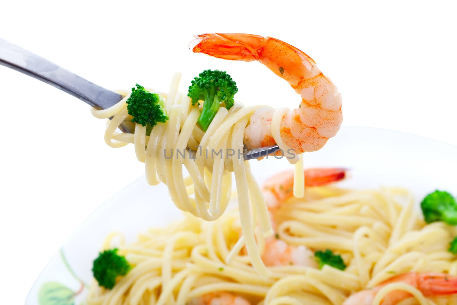 Shrimp Linguini with broccoli.  Focus on fork.  Shot on white background.