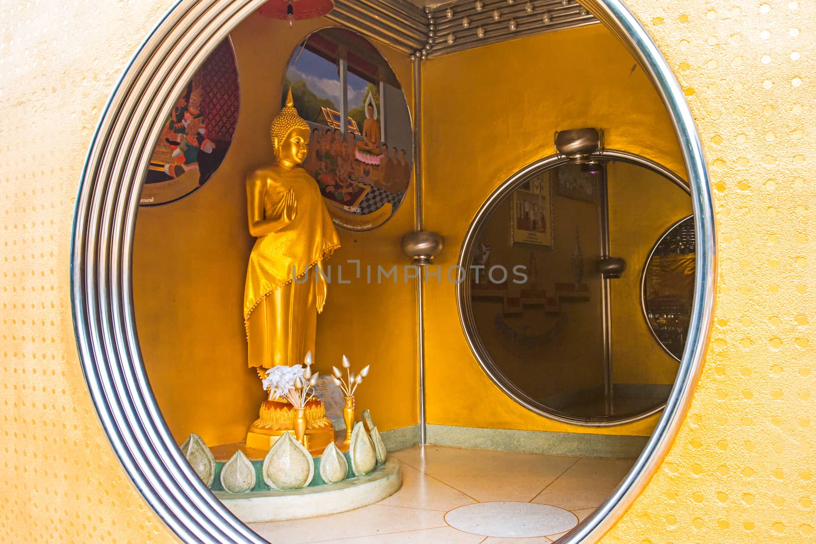 Golden Buddha Statue in the Circle at the stainless steel pagoda in Songkhla, Thailand