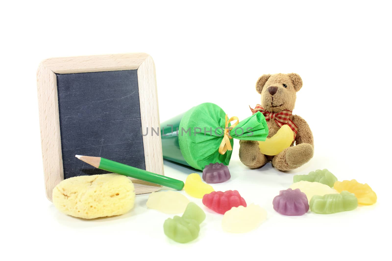 Teddy bear with school bag, wallet, pen and blackboard on a light background