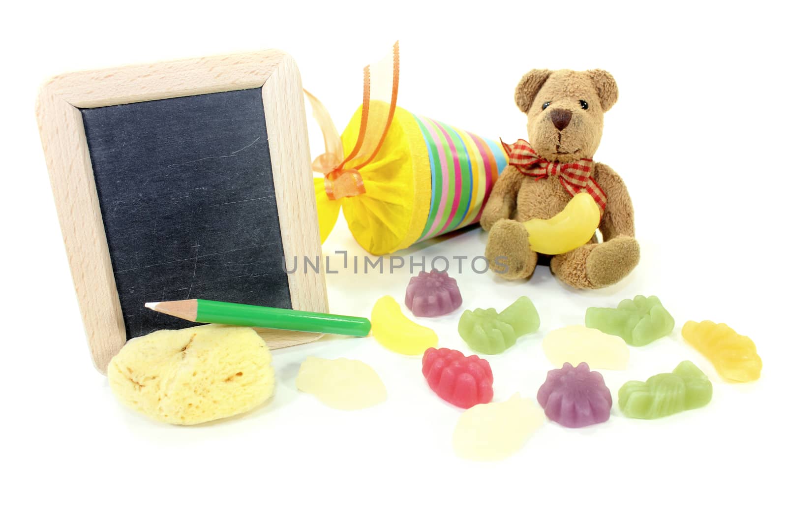 Teddy bear with school bag, wallet, sponge and blackboard on a light background