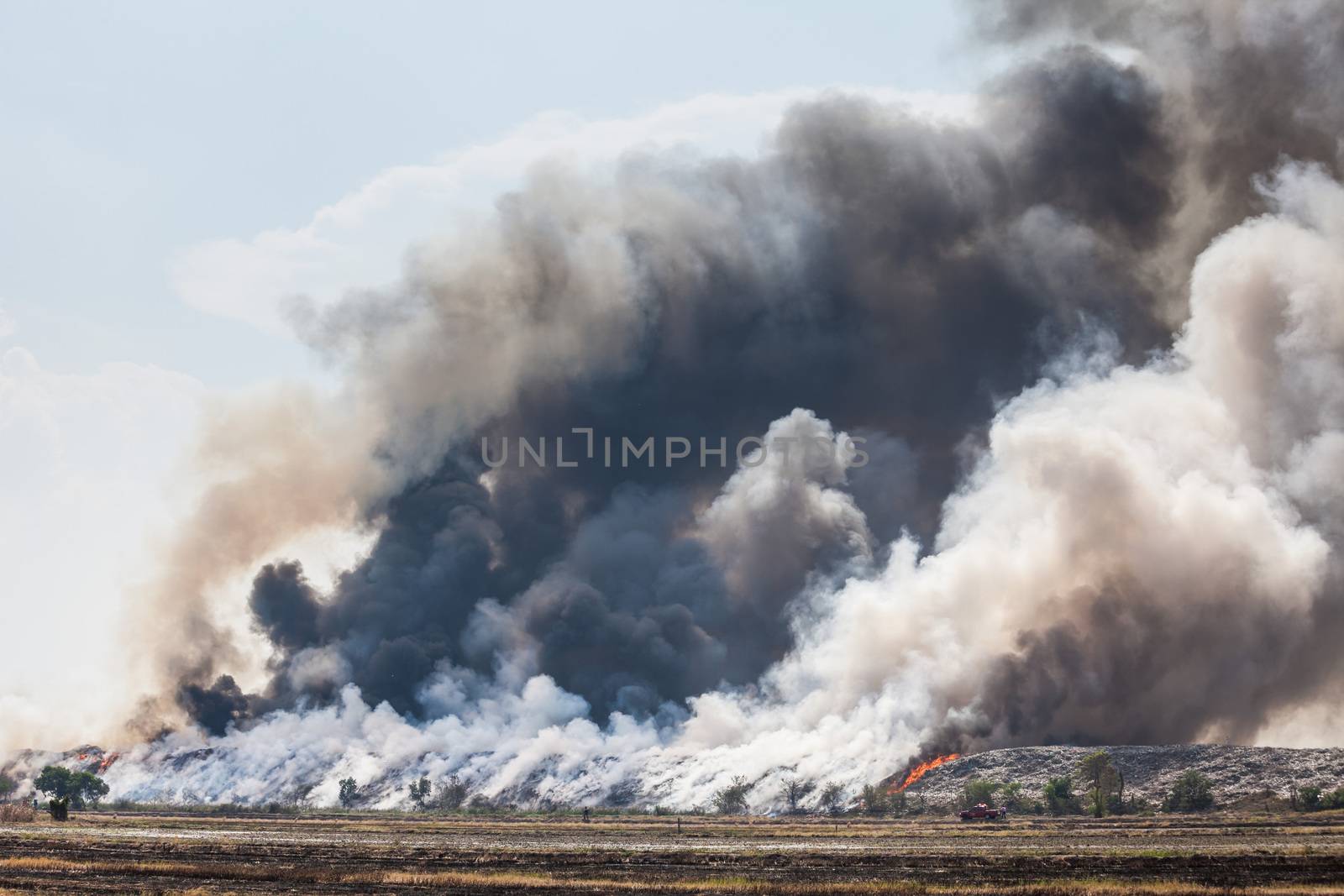 Burning garbage heap of smoke by witthaya