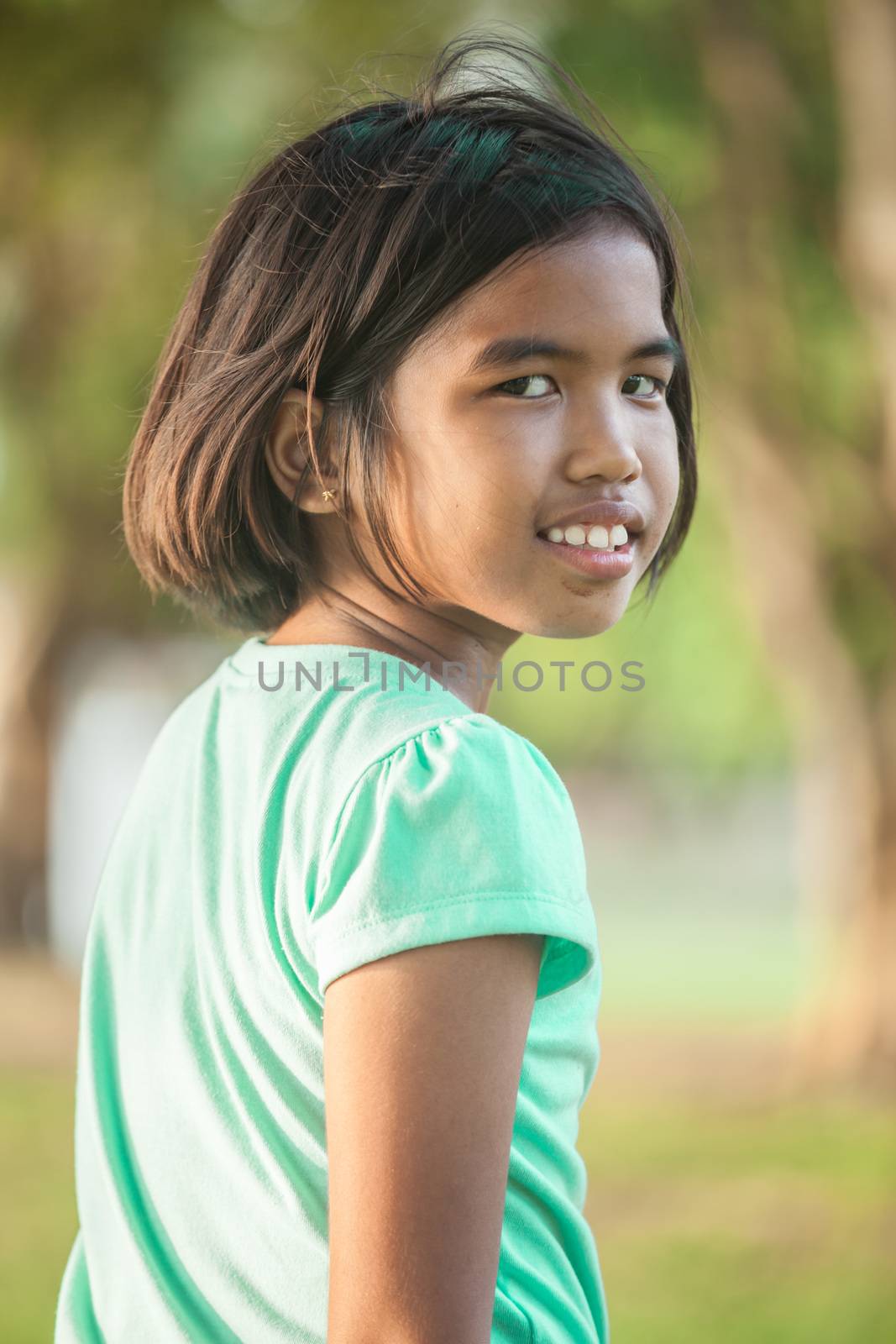 Portrait asian girl in the park on sunset