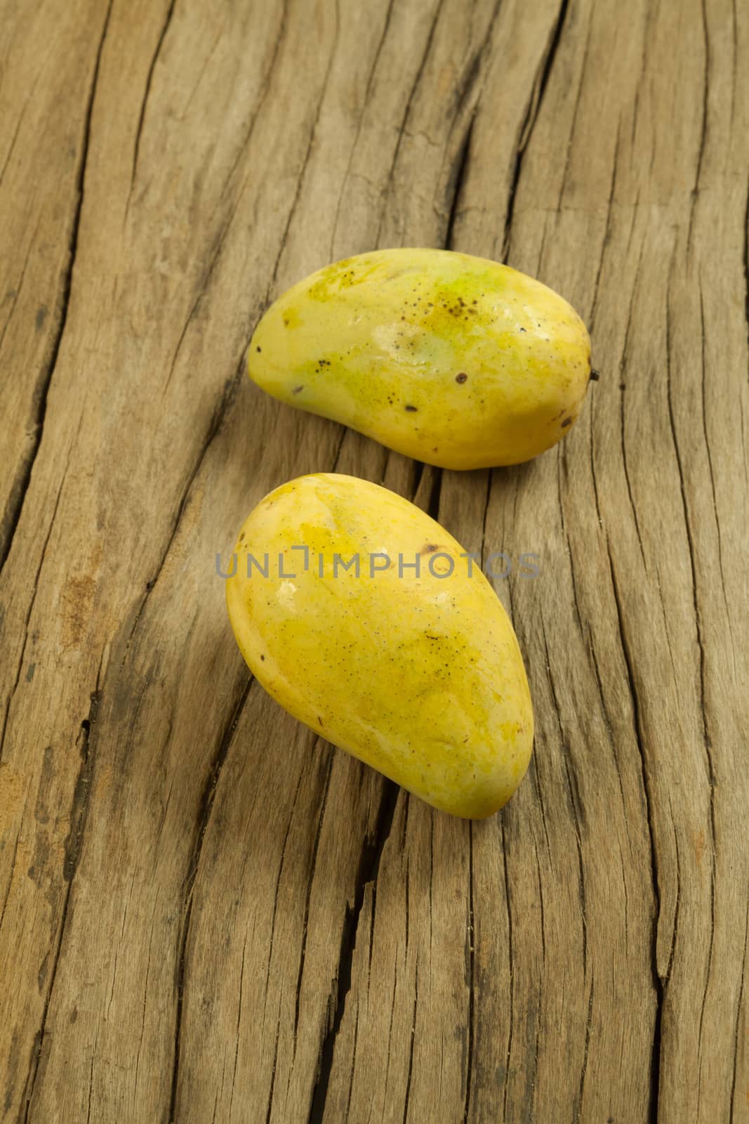 Mango fruit on a old wooden background