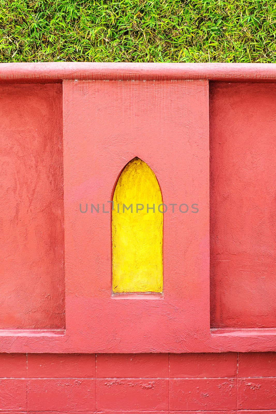 Yellow frame on red wall by NuwatPhoto