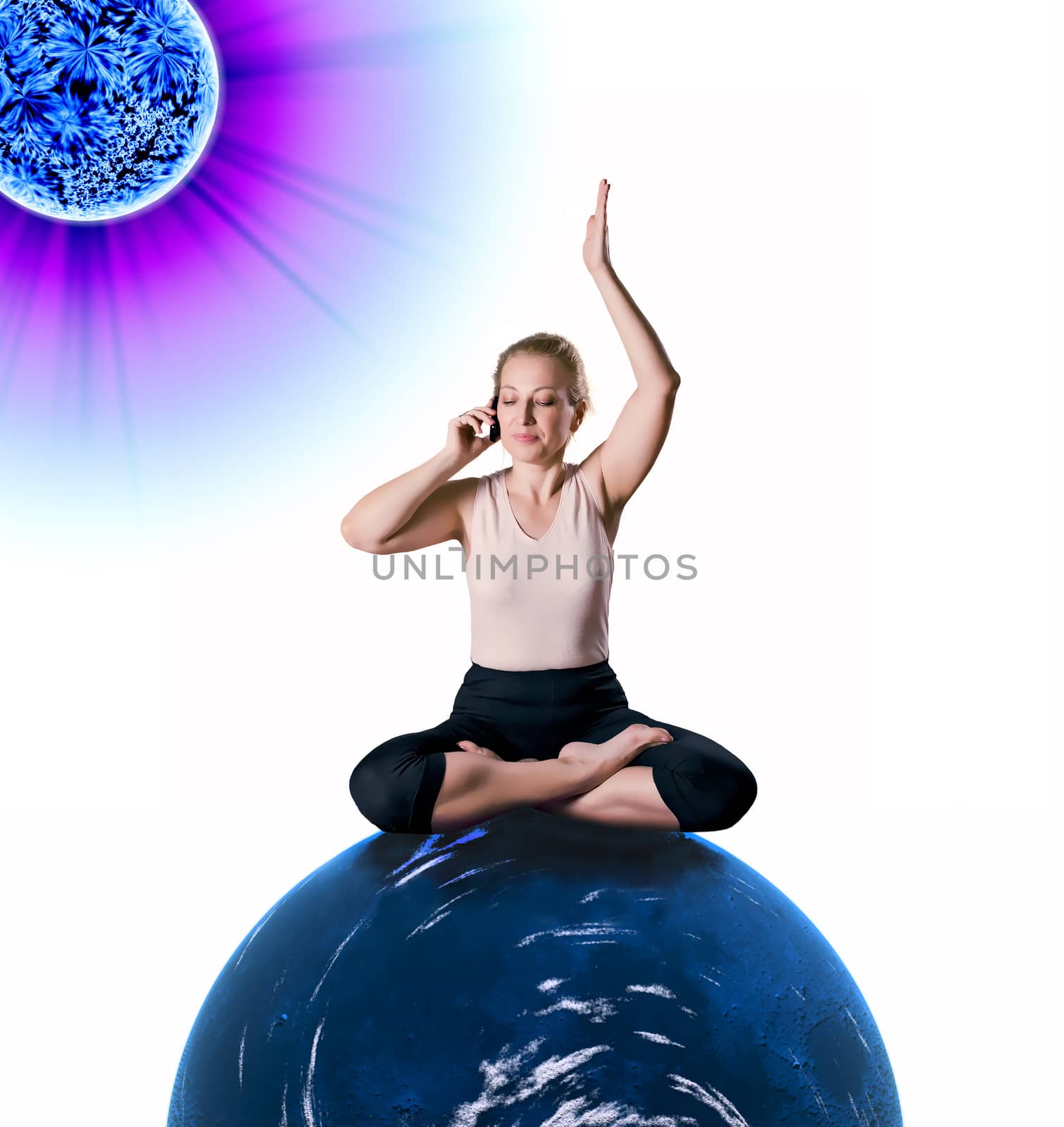 Woman sitting in lotus position on the blue planet, is holding the phone and listening