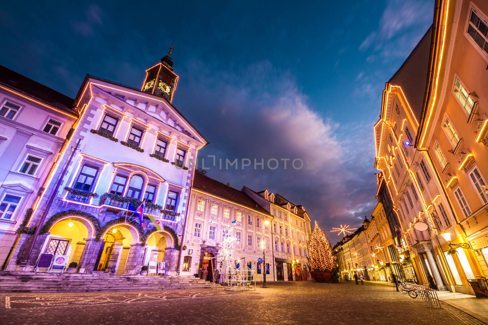 Romantic Ljubljana's city center, the capital of Slovenia, Europe. City hall and Roba's fountain shot at dusk.