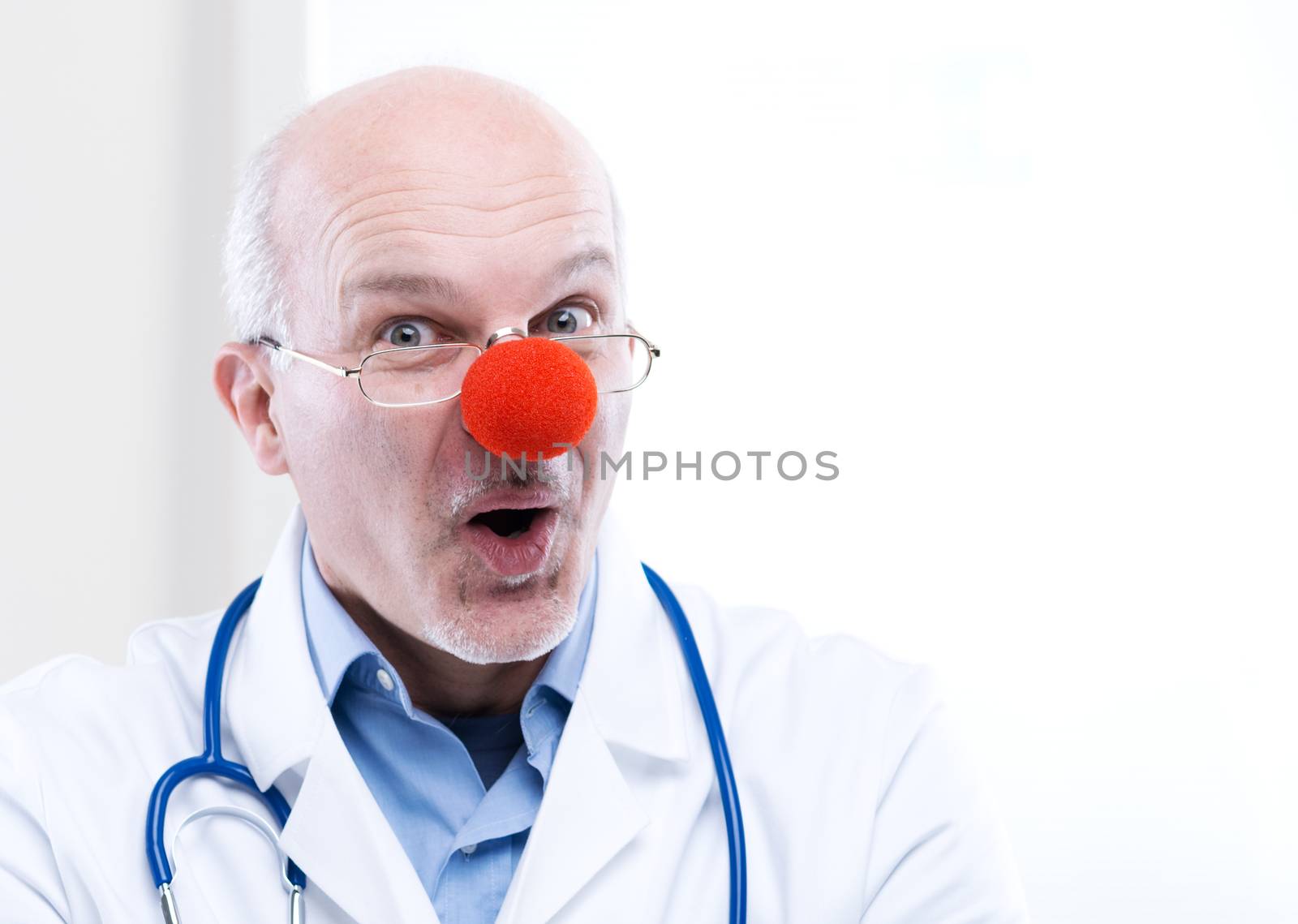 Clown doctor portrait with medical equipment.