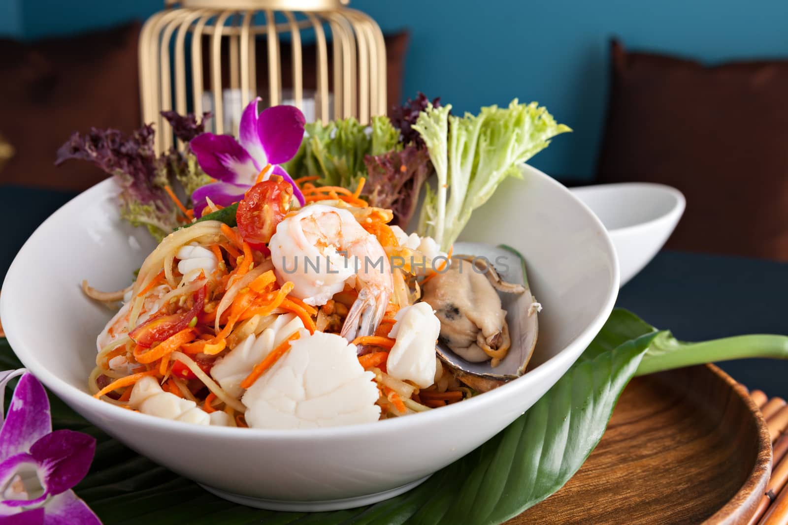 Traditional dish of freshly prepared Thai food.  Thai seafood and som tum green papaya salad.