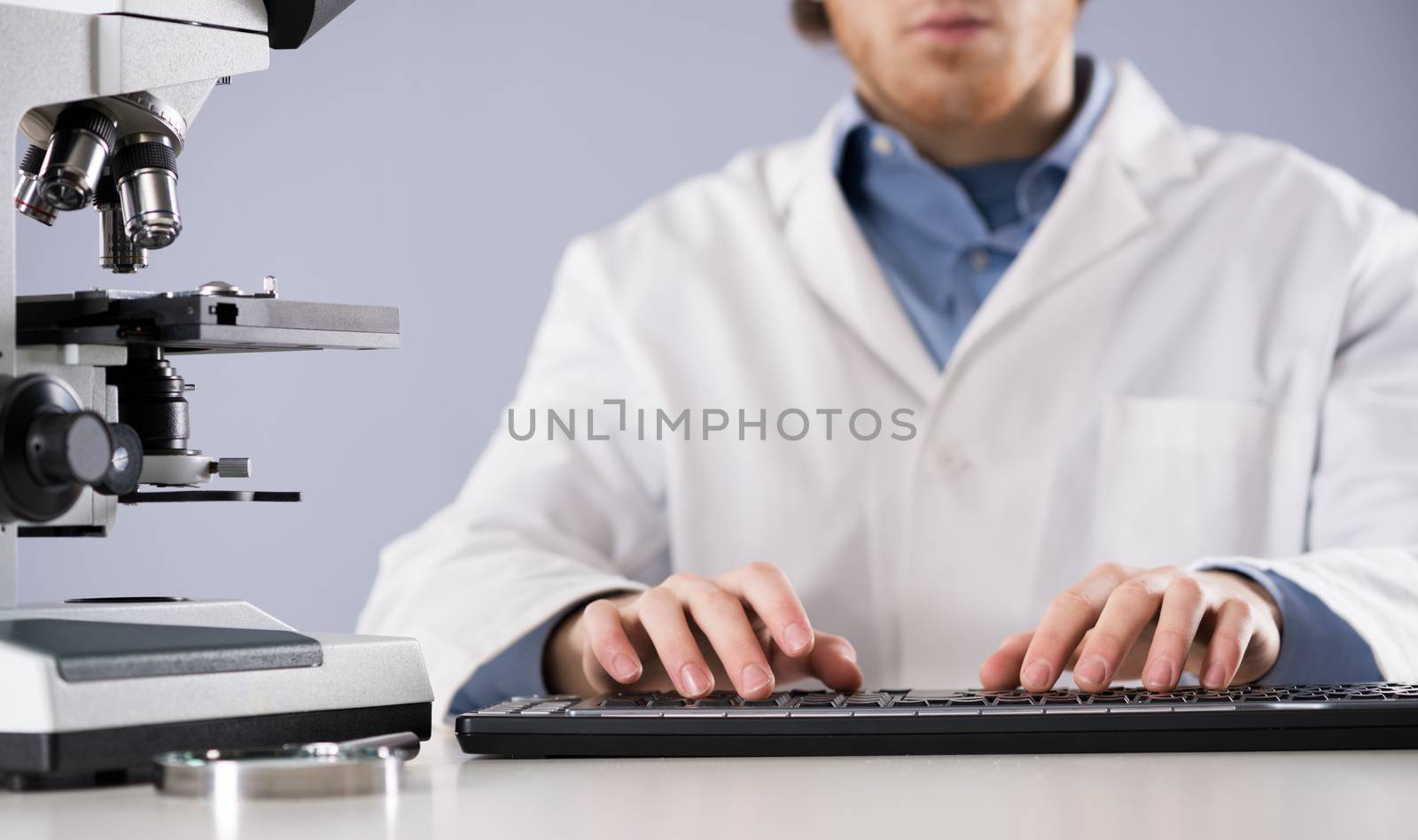 Researcher working at computer by stokkete