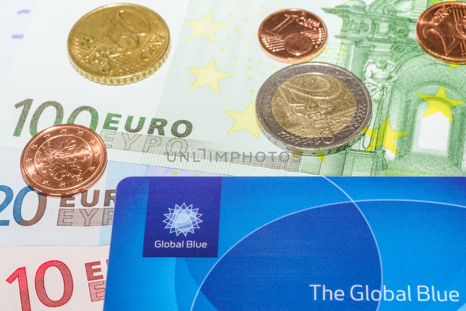 MUNICH, GERMANY - FEBRUARY 23, 2014: European Euro bank notes Cent coins and Global Blue card