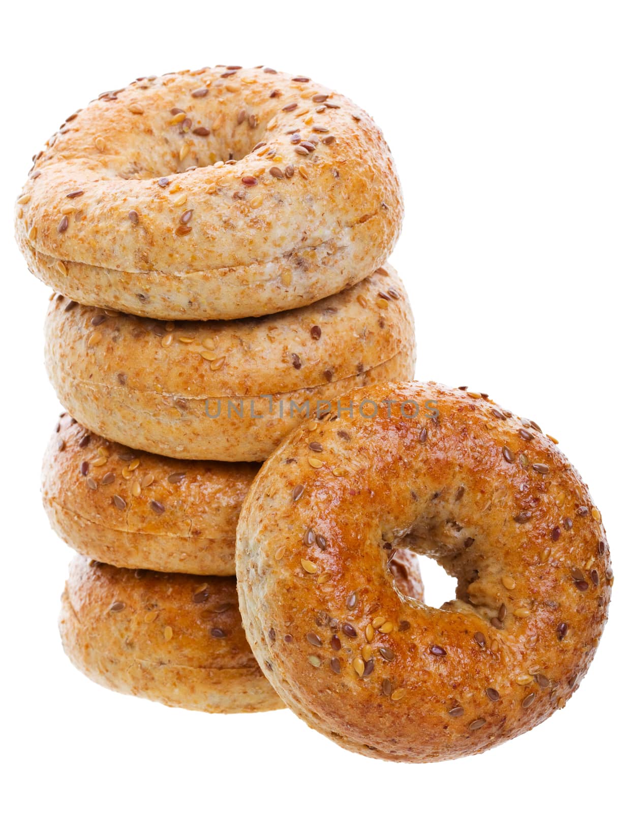 A stack of golden brown, multi-grain bagels.  Shot on white background.